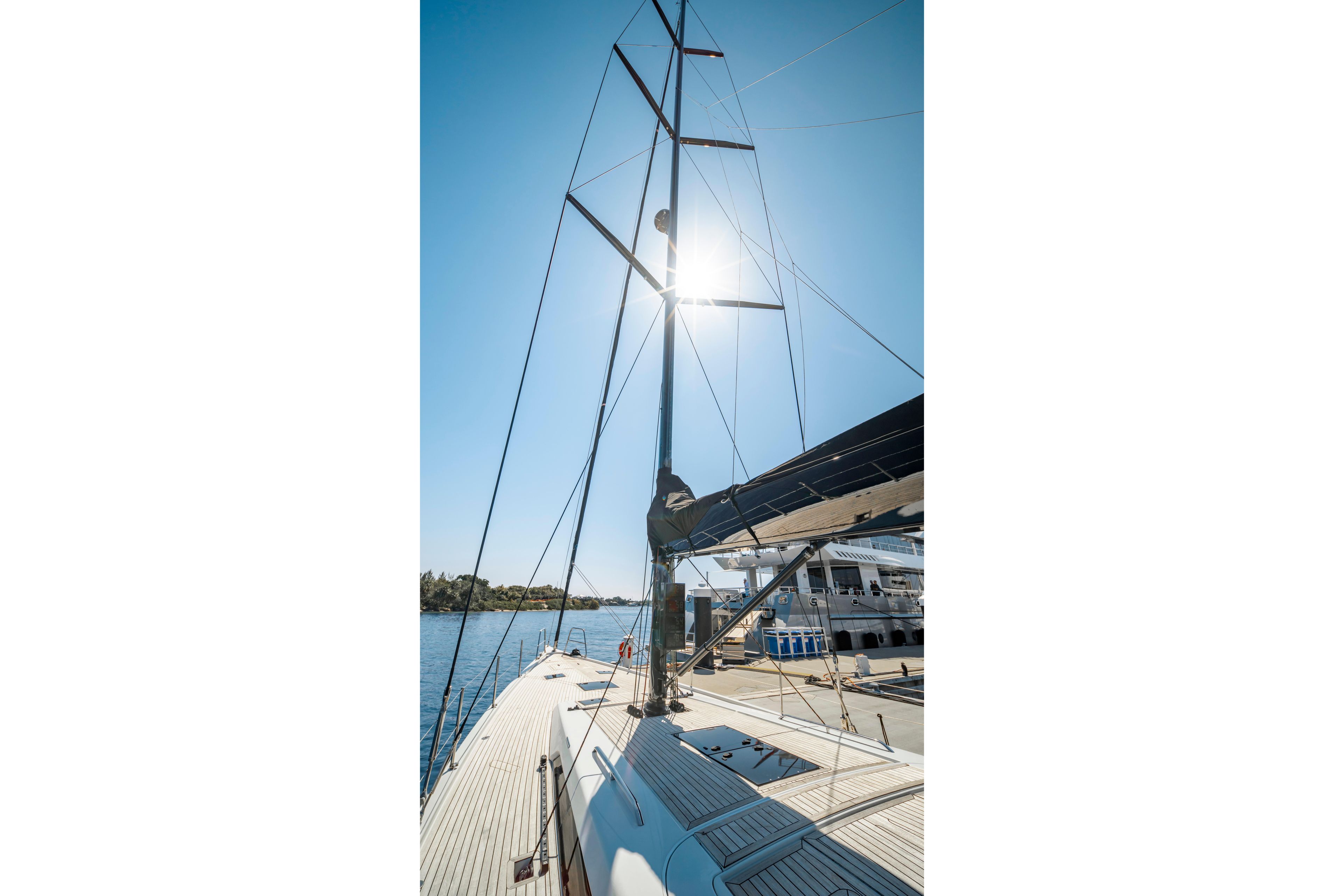 Sailing yacht Grand Soleil 58, 2016 model, docked under clear blue sky.