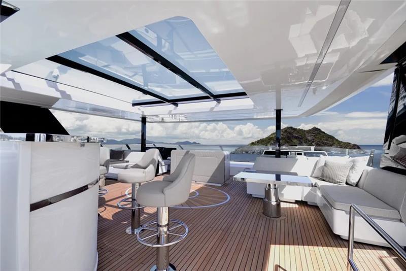 Luxurious 2026 Sunreef 80 Sunreef Power yacht with elegant outdoor seating and ocean view.