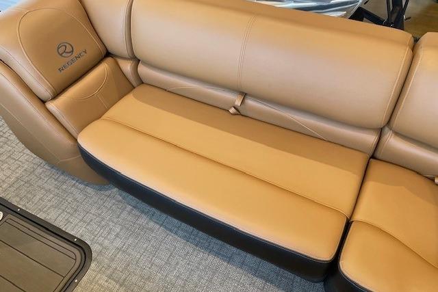 Luxurious tan leather seating in 2026 Regency 230 DL boat interior.