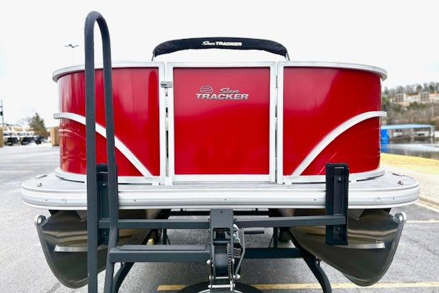 2026 Sun Tracker Party Barge 18 DLX pontoon boat, red exterior, rear view.