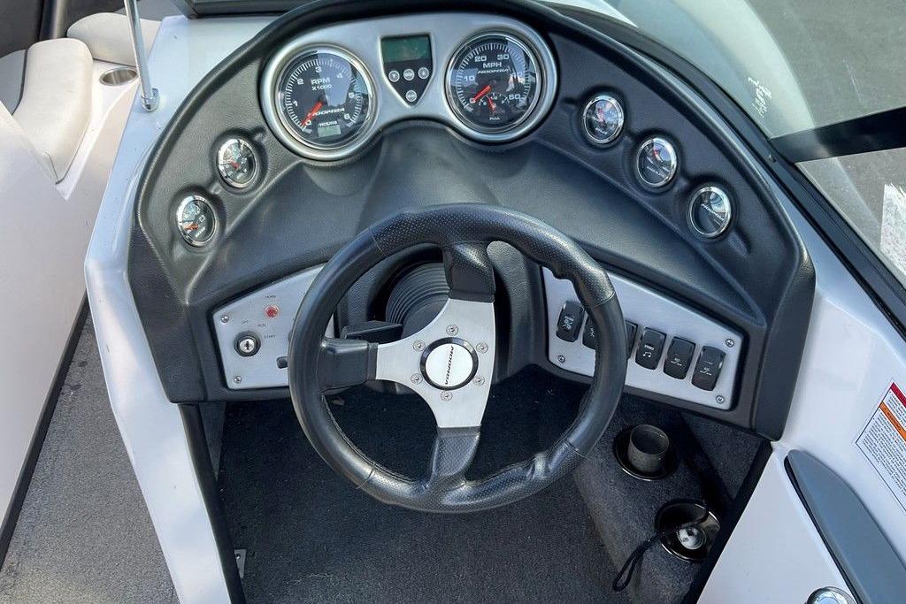 2015 Moomba Outback V dashboard with steering wheel and gauges.