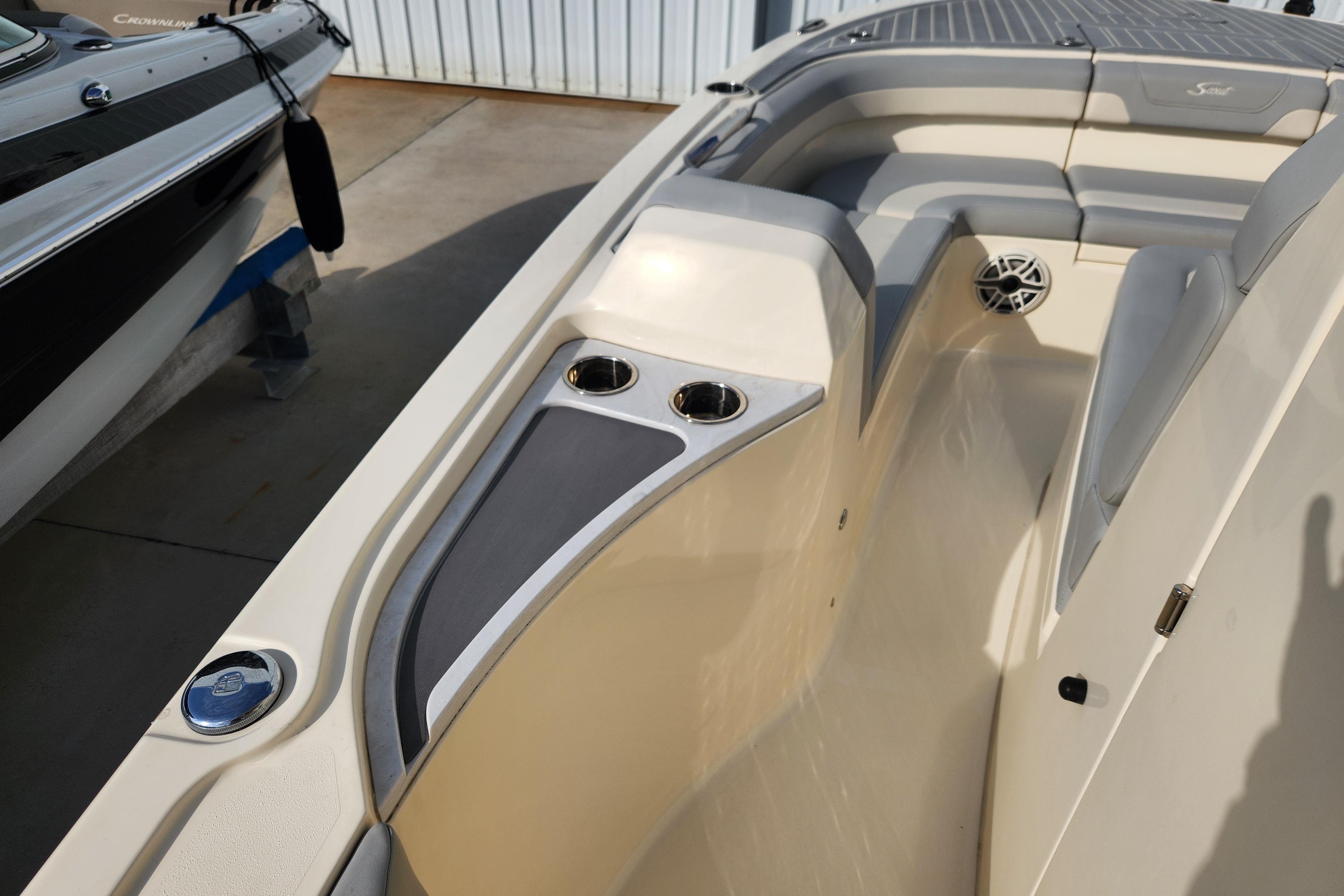 2024 Scout 281 XSS boat interior with cup holders and seating area.