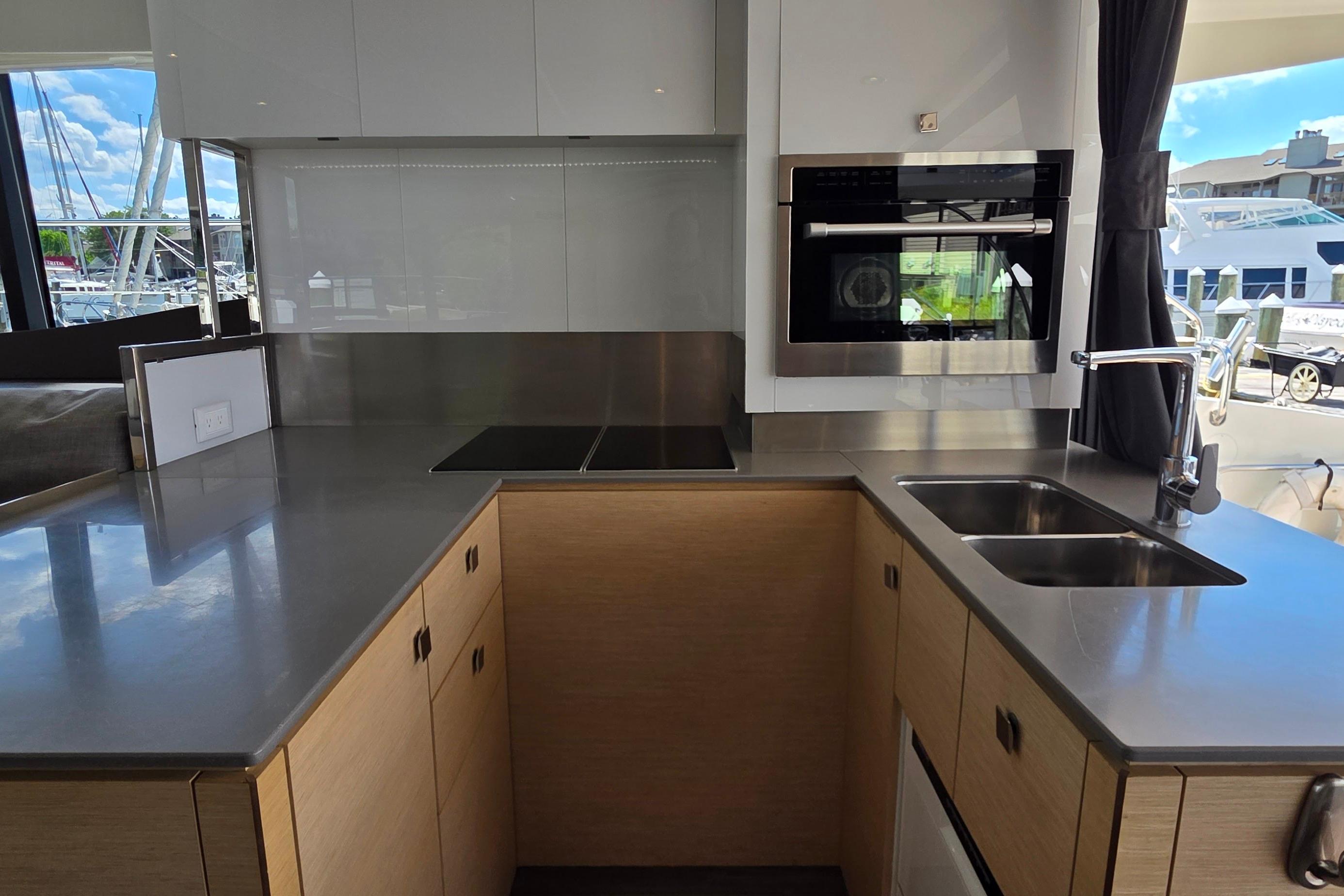 Modern kitchen interior of 2018 Fountaine Pajot Motor Yacht 44 with sleek countertops.