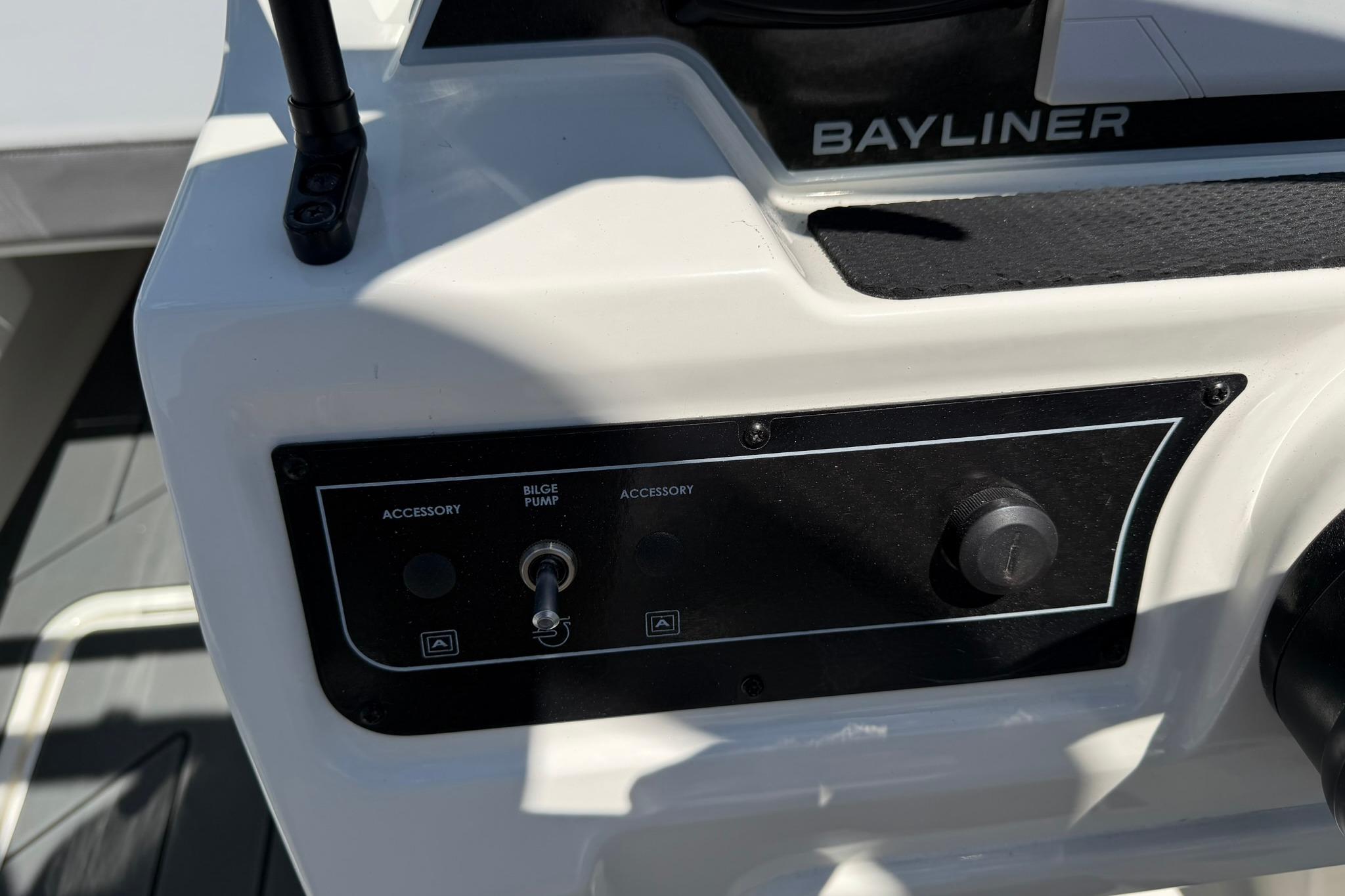 Control panel of 2026 Bayliner D20 boat with bilge pump switch and accessory controls.