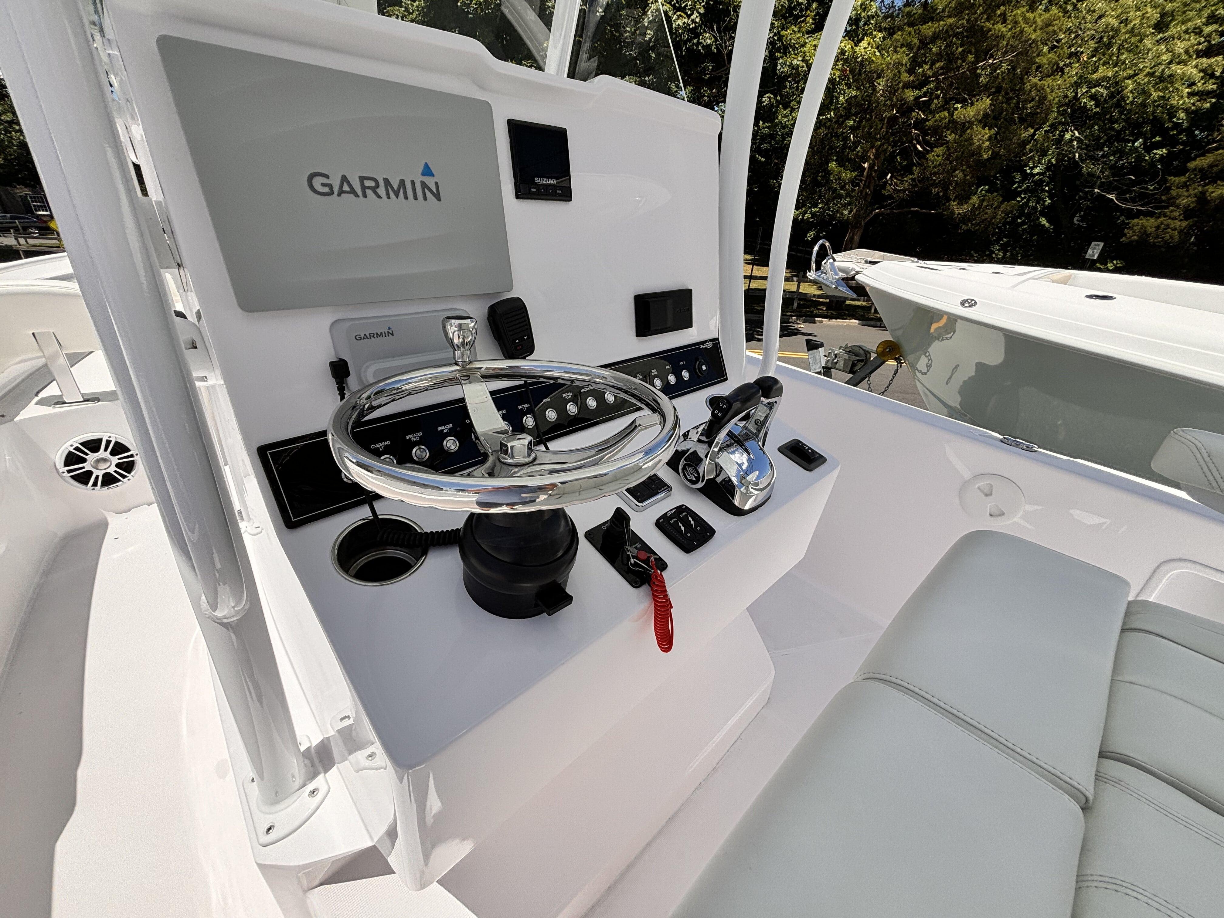 2022 Streamline 26CC boat console with Garmin navigation system and steering wheel.