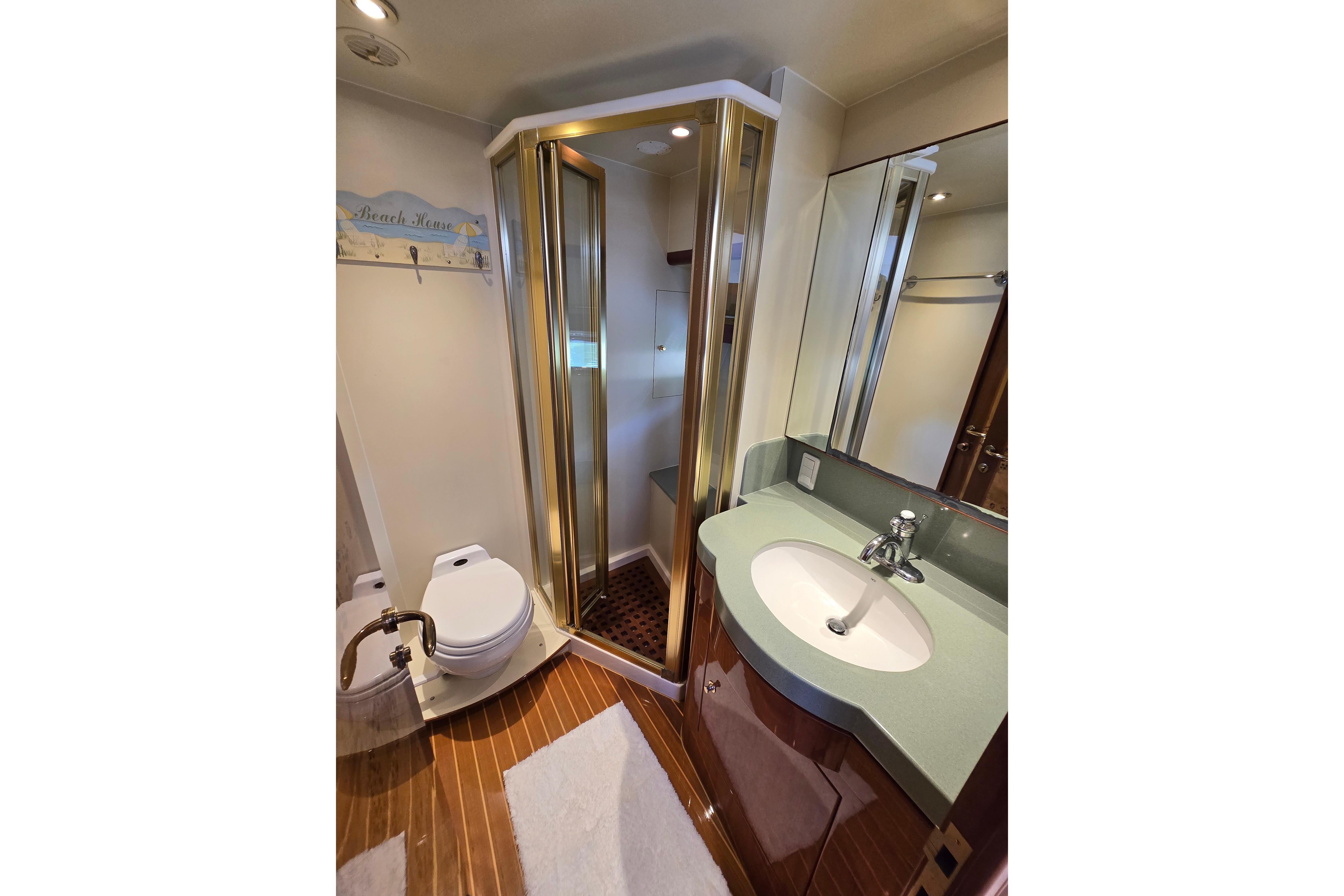 Luxurious 2004 Grand Harbour 58 yacht bathroom with modern fixtures and elegant design.