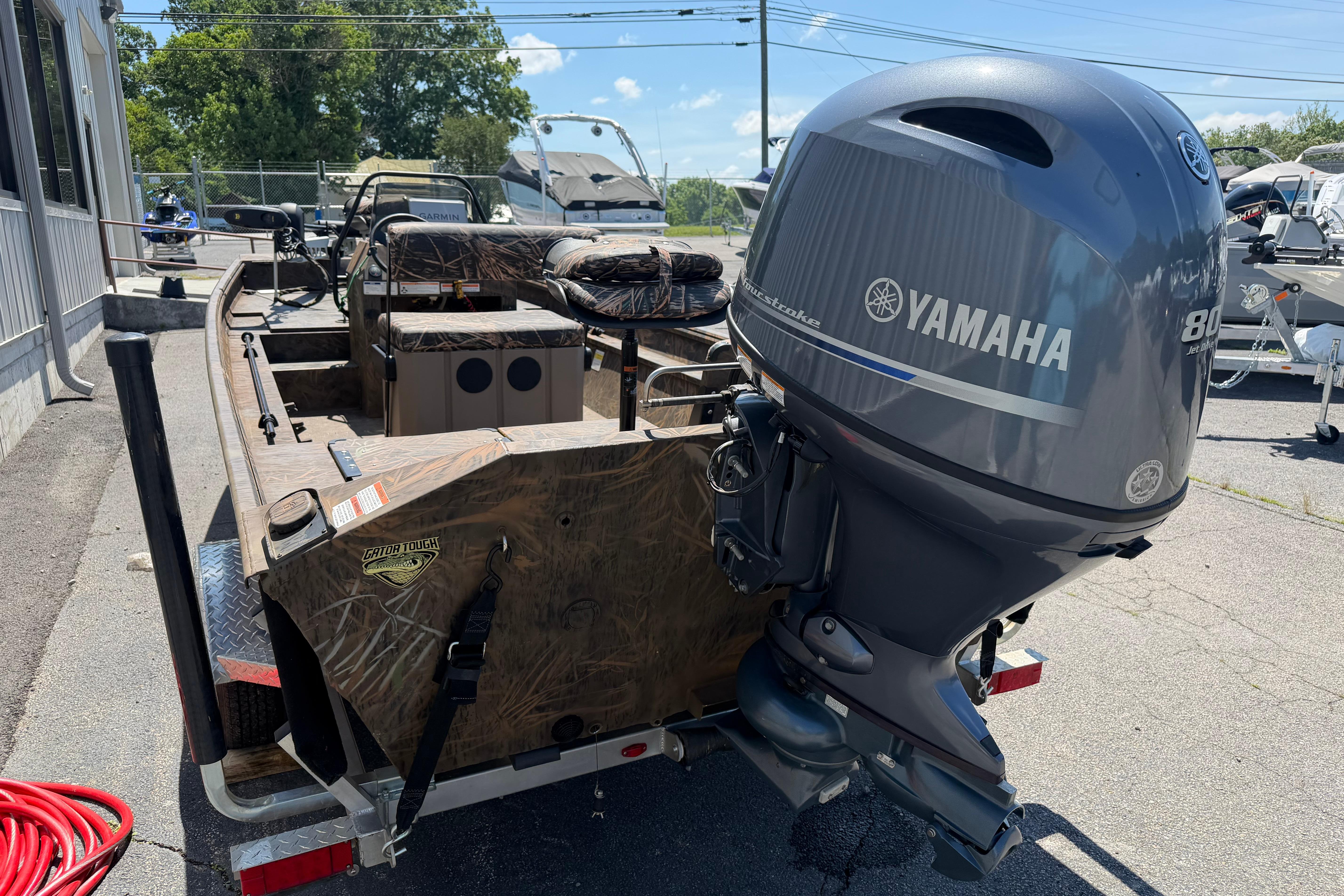 2023 G3 Gator Tough 18 CCJ boat with Yamaha outboard motor, parked outdoors.