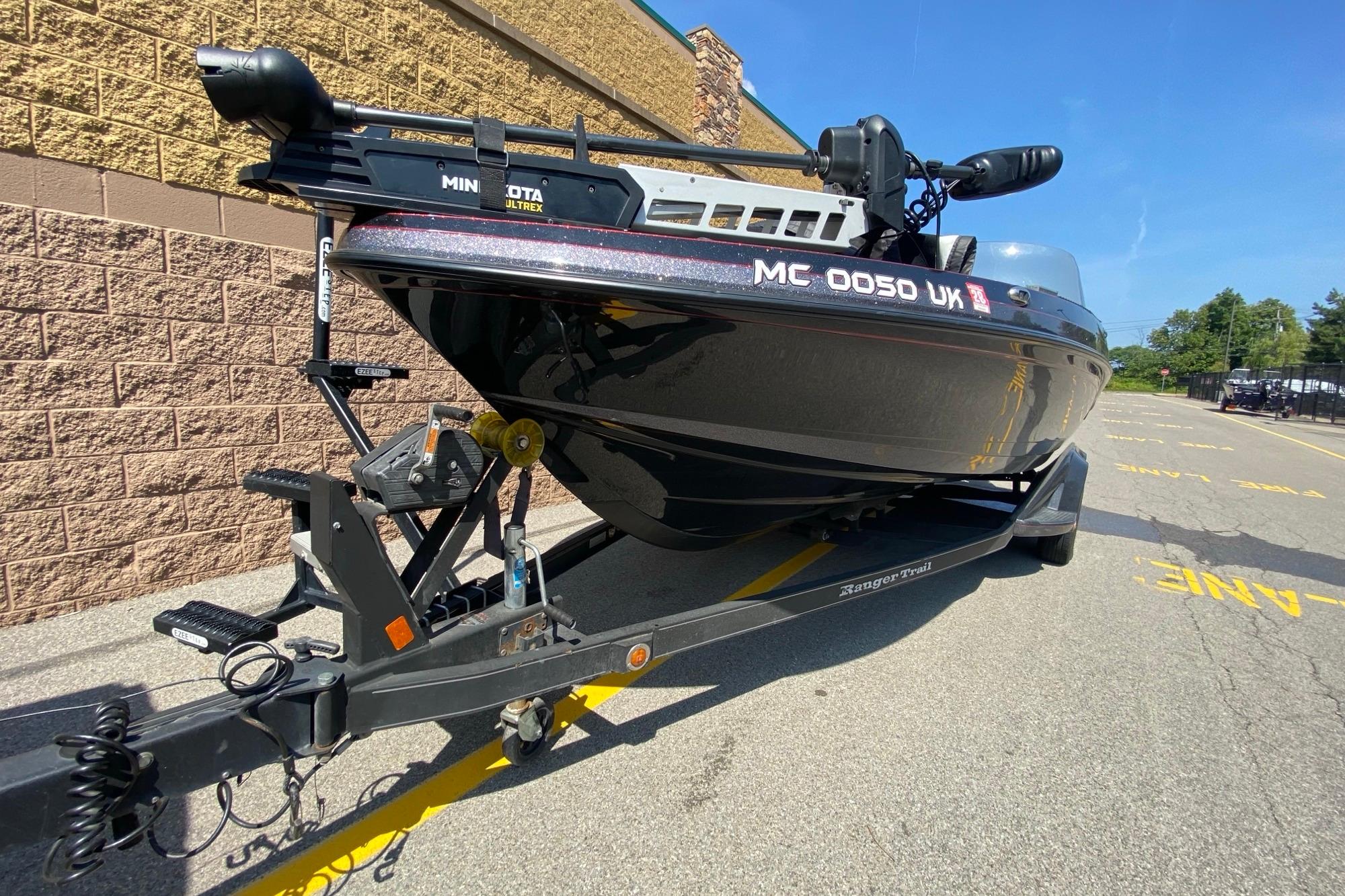 2017 Ranger 621FS Fisherman boat on trailer, parked outdoors on sunny day.