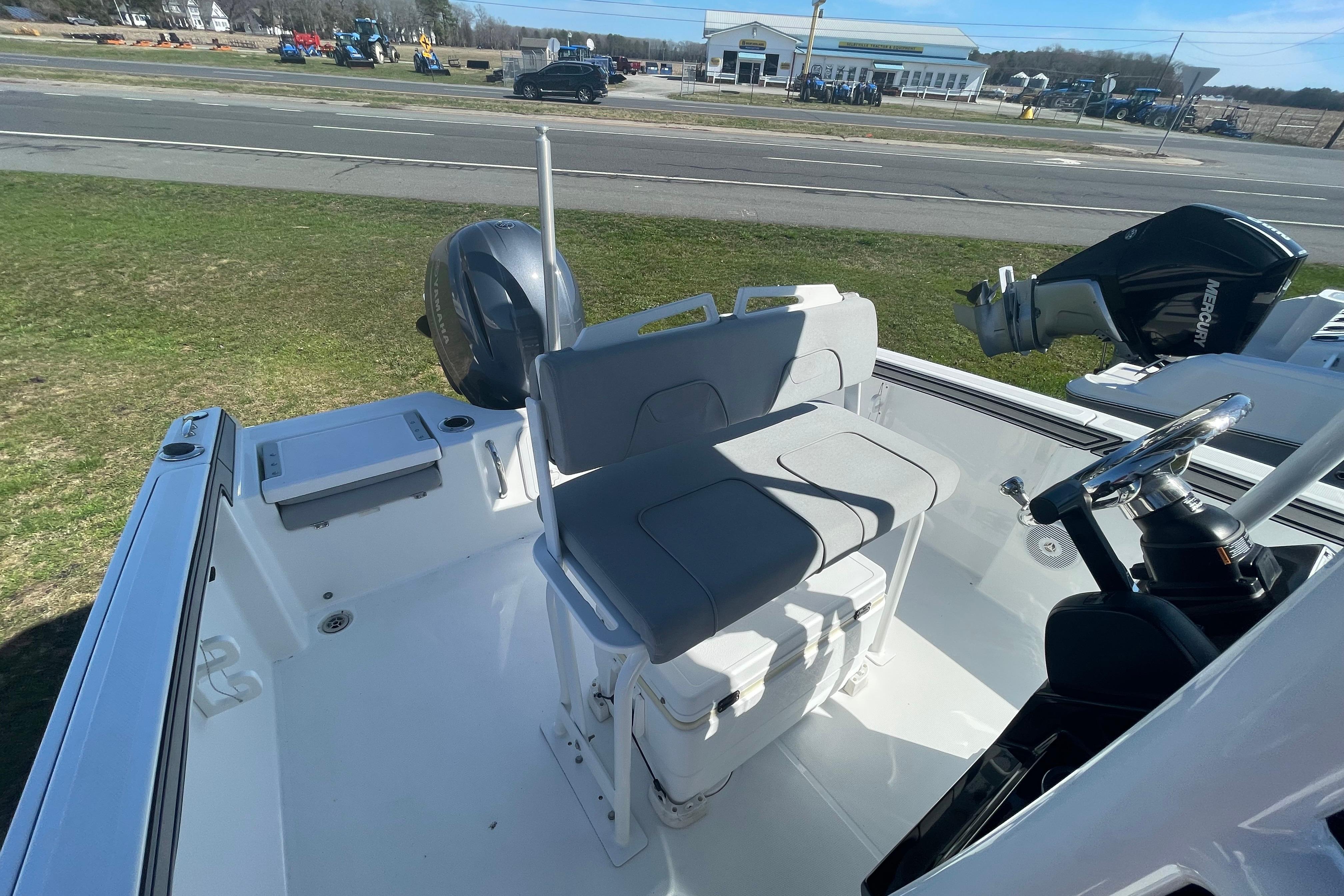 2022 Wellcraft 202 Fisherman boat interior with seating and steering wheel.