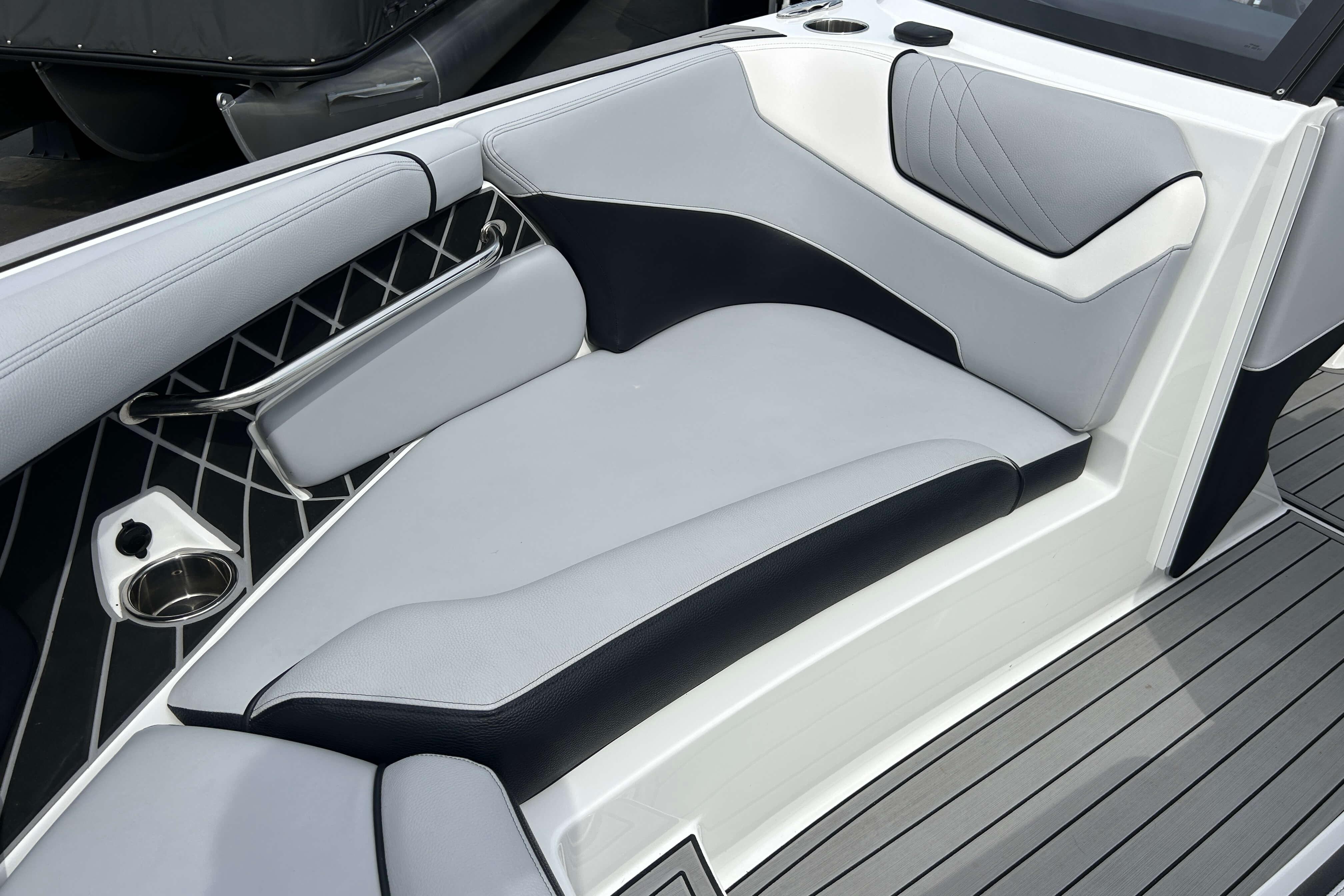 2021 Nautique Super Air Nautique GS24 interior seating with sleek, modern design and cup holder.