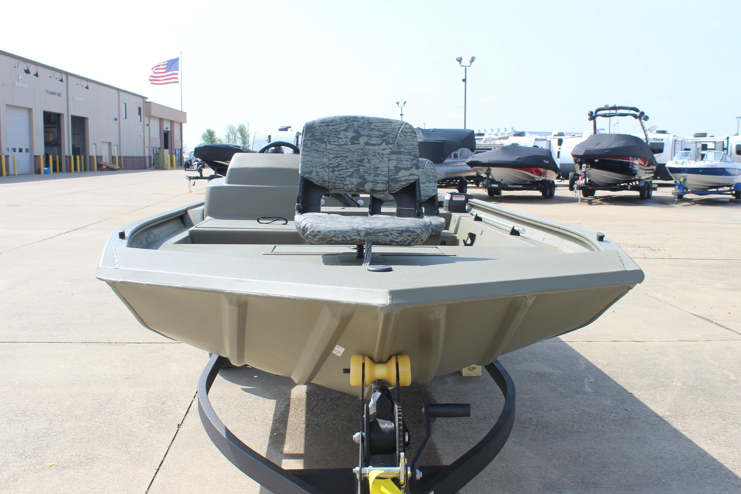 2026 Tracker Grizzly 1754 SC boat on trailer at dealership lot.