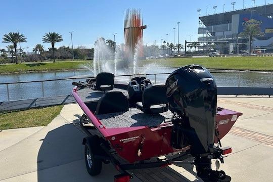 2026 Tracker Pro Team 175 boat near a fountain and stadium.