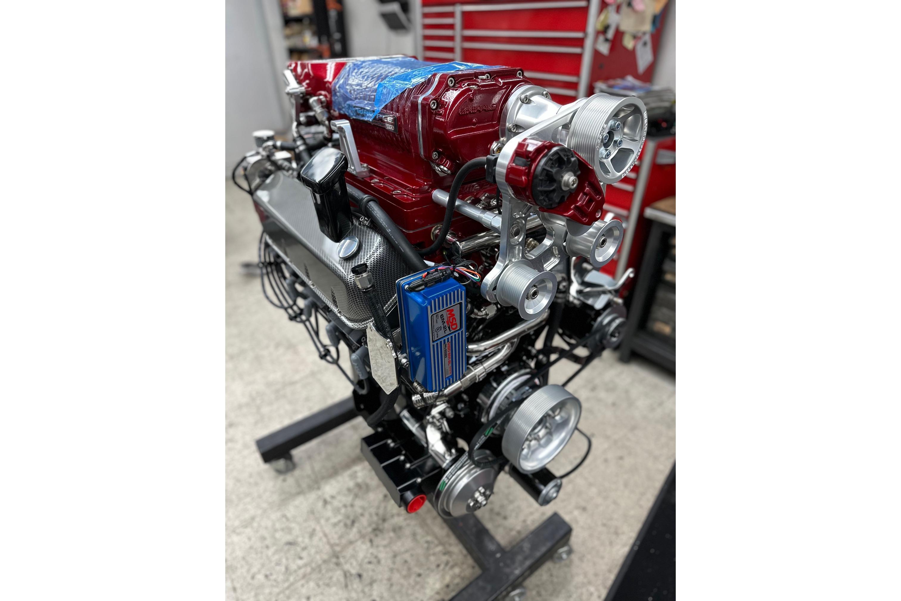 High-performance engine of a 2013 Nordic 39 Poker Run boat in a workshop setting.