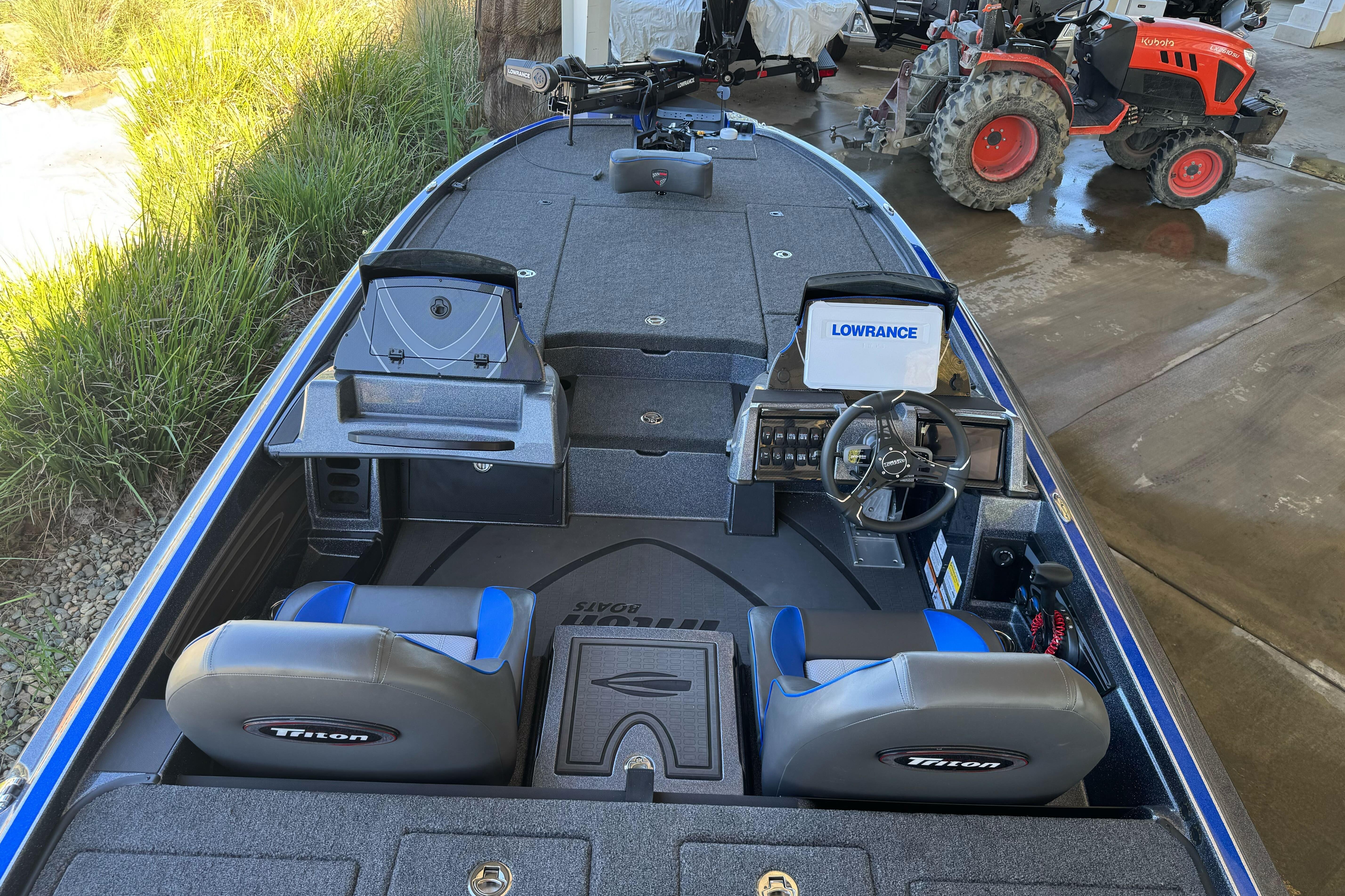 2026 Triton 21XP Patriot boat interior with dual seats and Lowrance electronics.