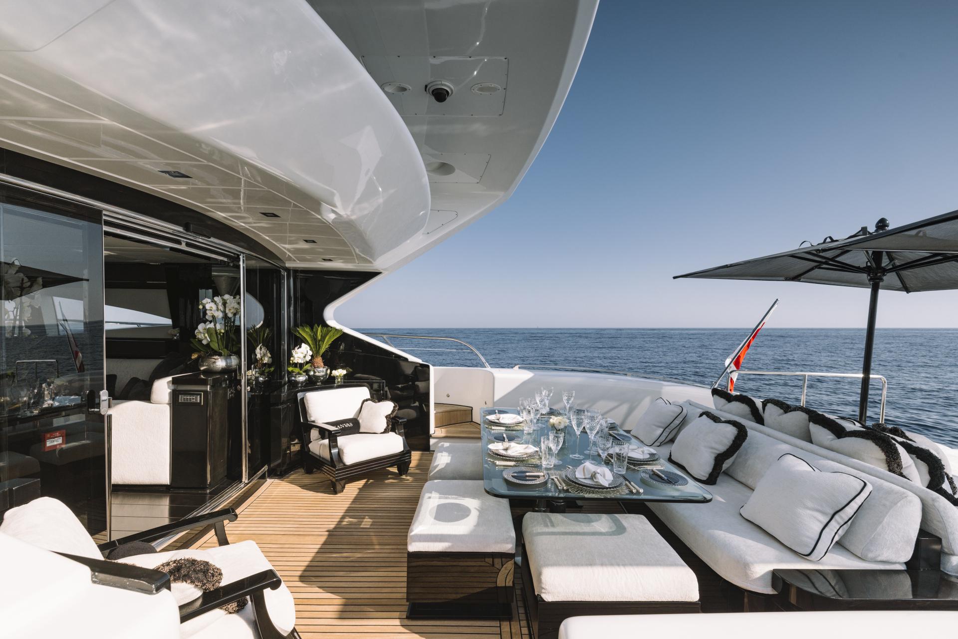Luxurious 2008 Mangusta 108 yacht deck with elegant seating and ocean view.