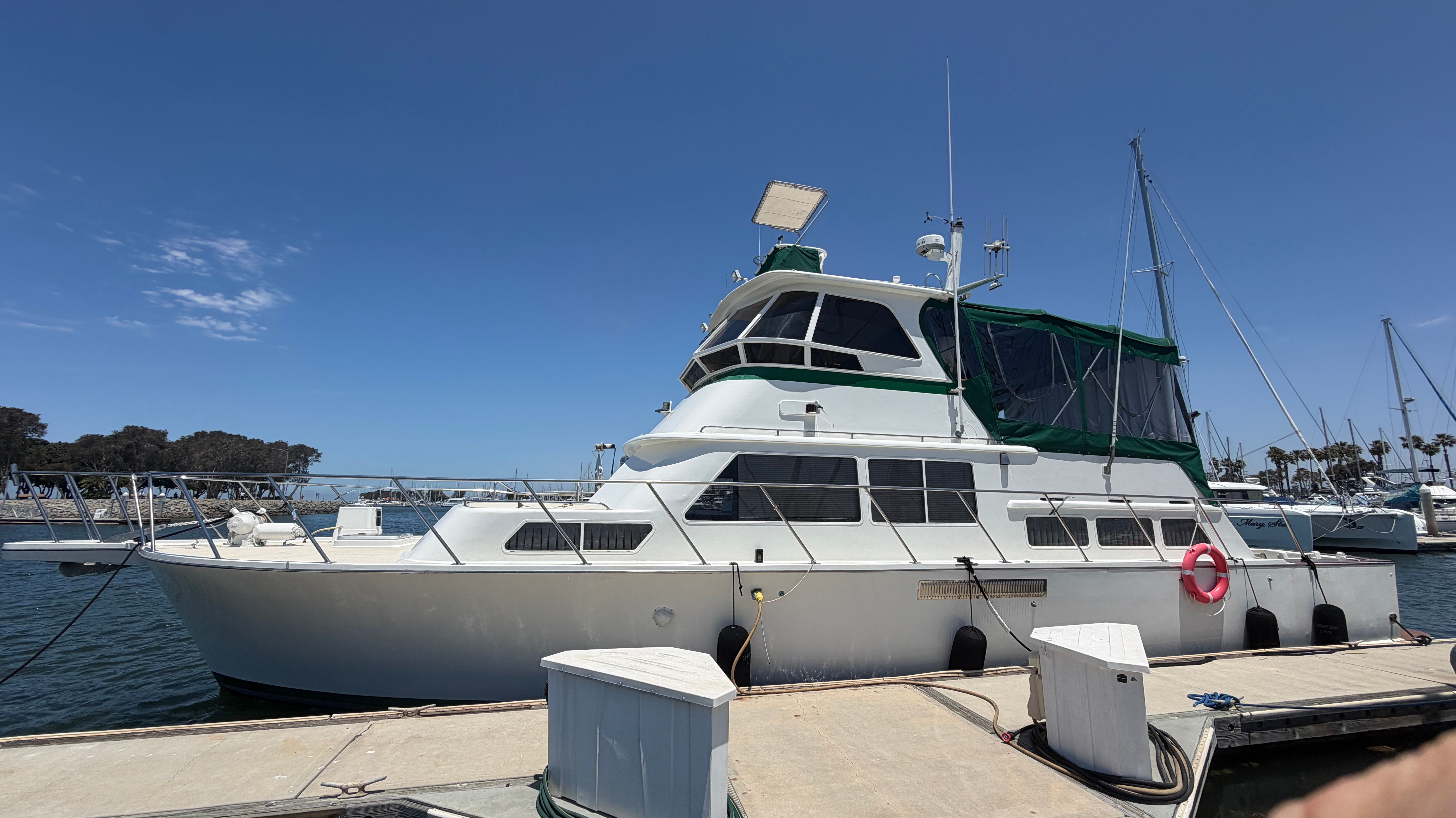 1966 Drake Yachtfisher docked on a sunny day.