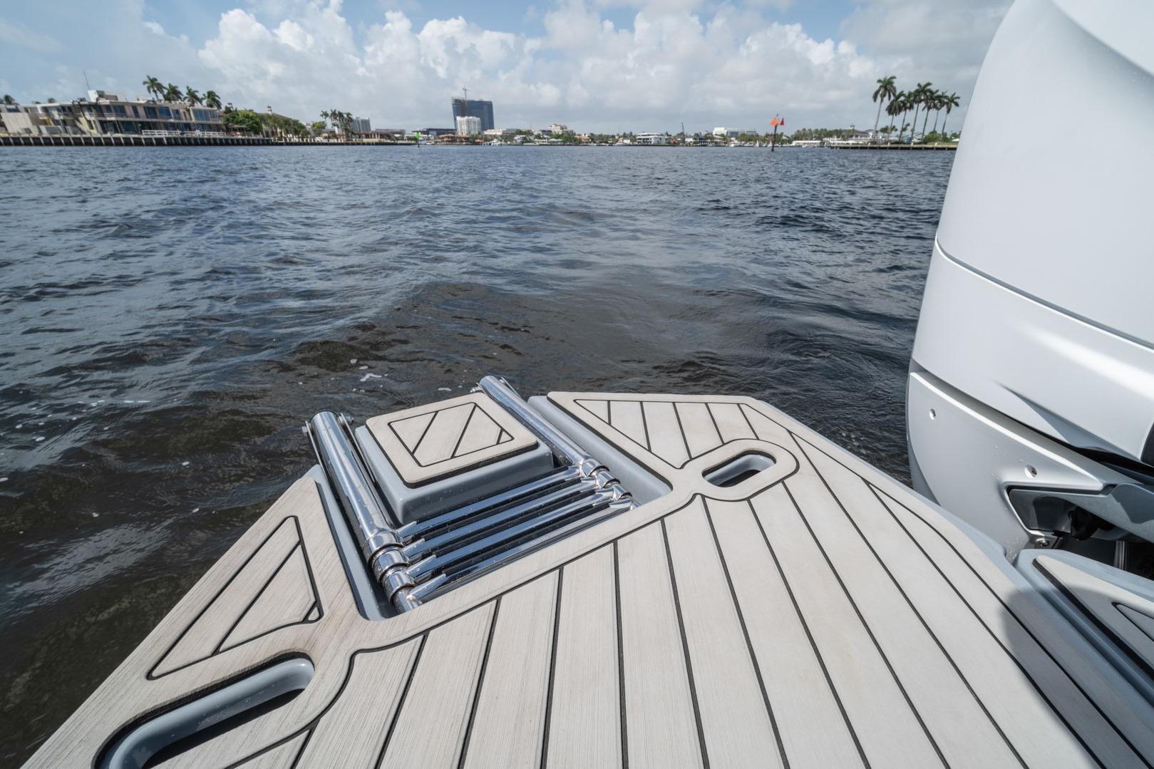 Sleek Hanover 387 boat deck, 2026 model, overlooking calm waters and distant shoreline.