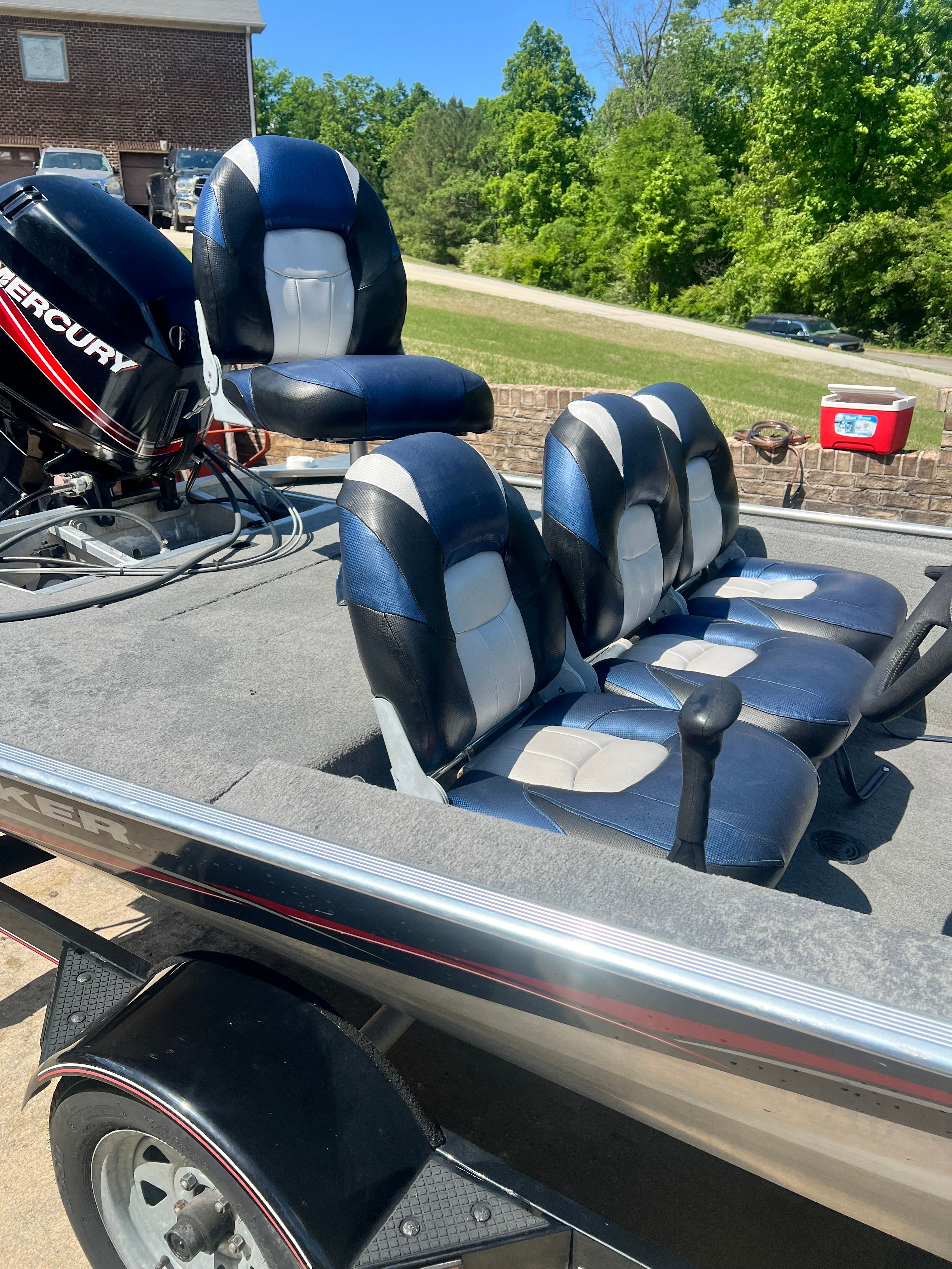 2007 Bass Tracker Pro 170 boat with blue seats and Mercury engine.