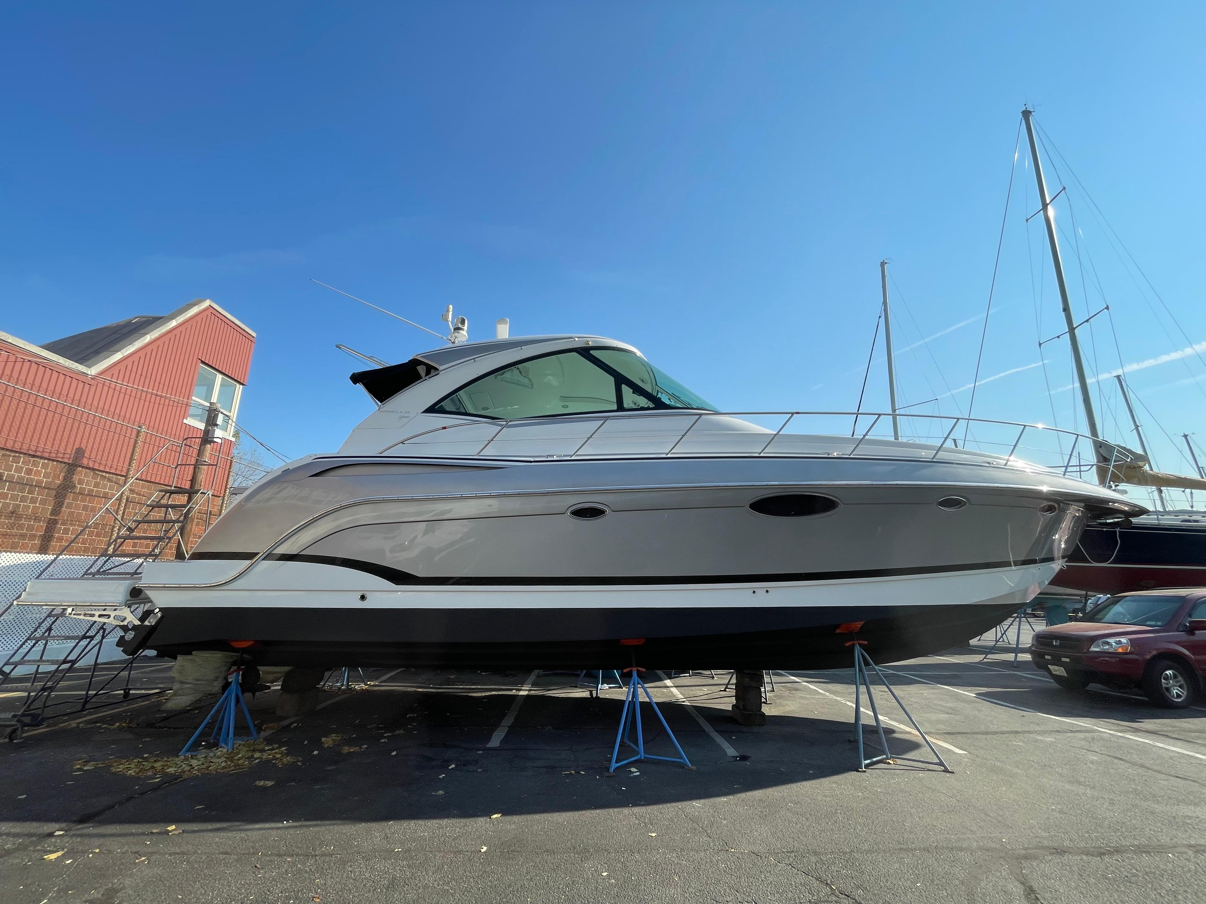 2014 Formula 45 Yacht on stands in a marina, clear blue sky background.