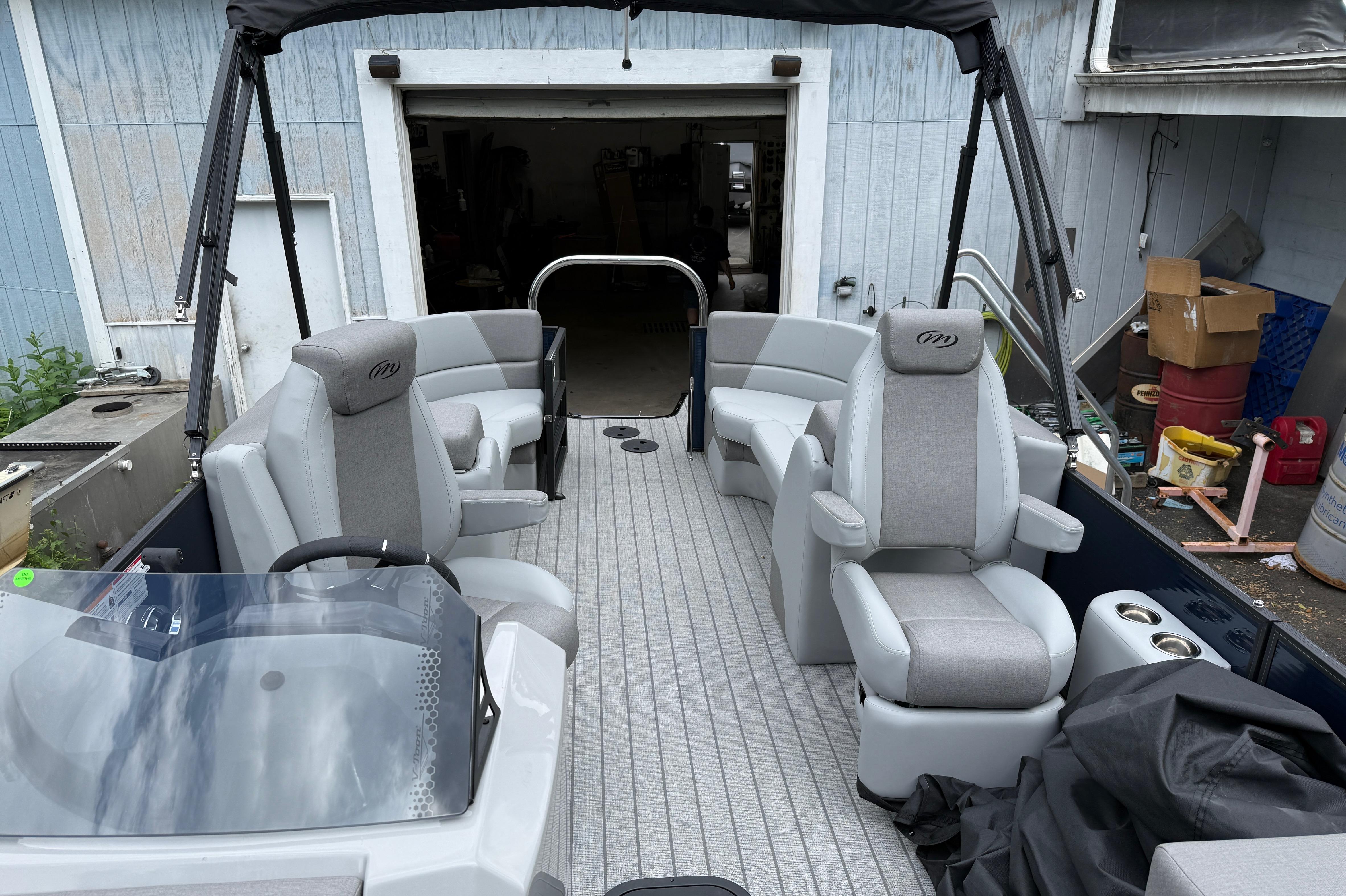 2027 Manitou Aurora RF 23 pontoon boat interior with gray seating and modern design.