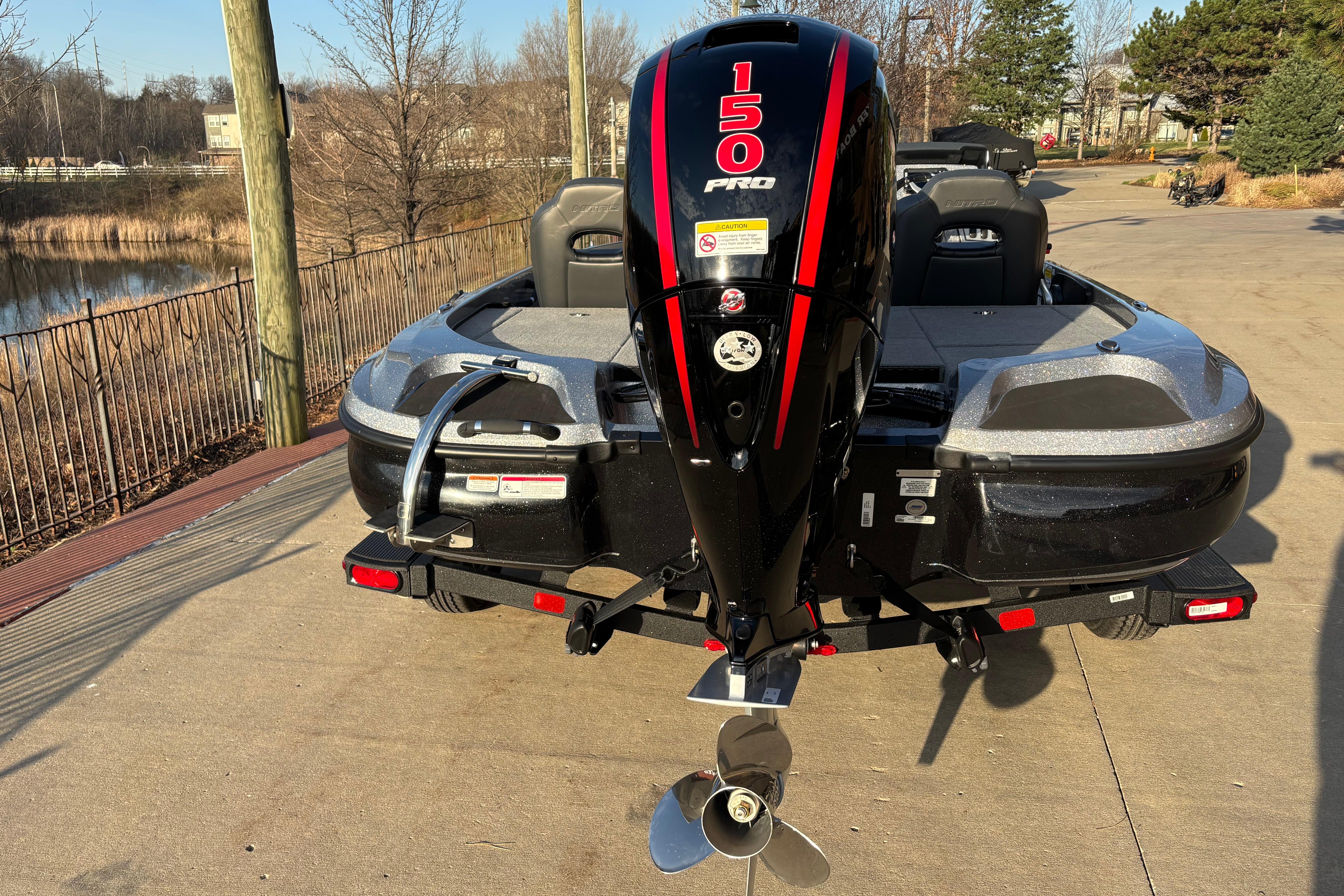 2026 Nitro Z18 boat with 150 Pro motor, parked on a sunny day.