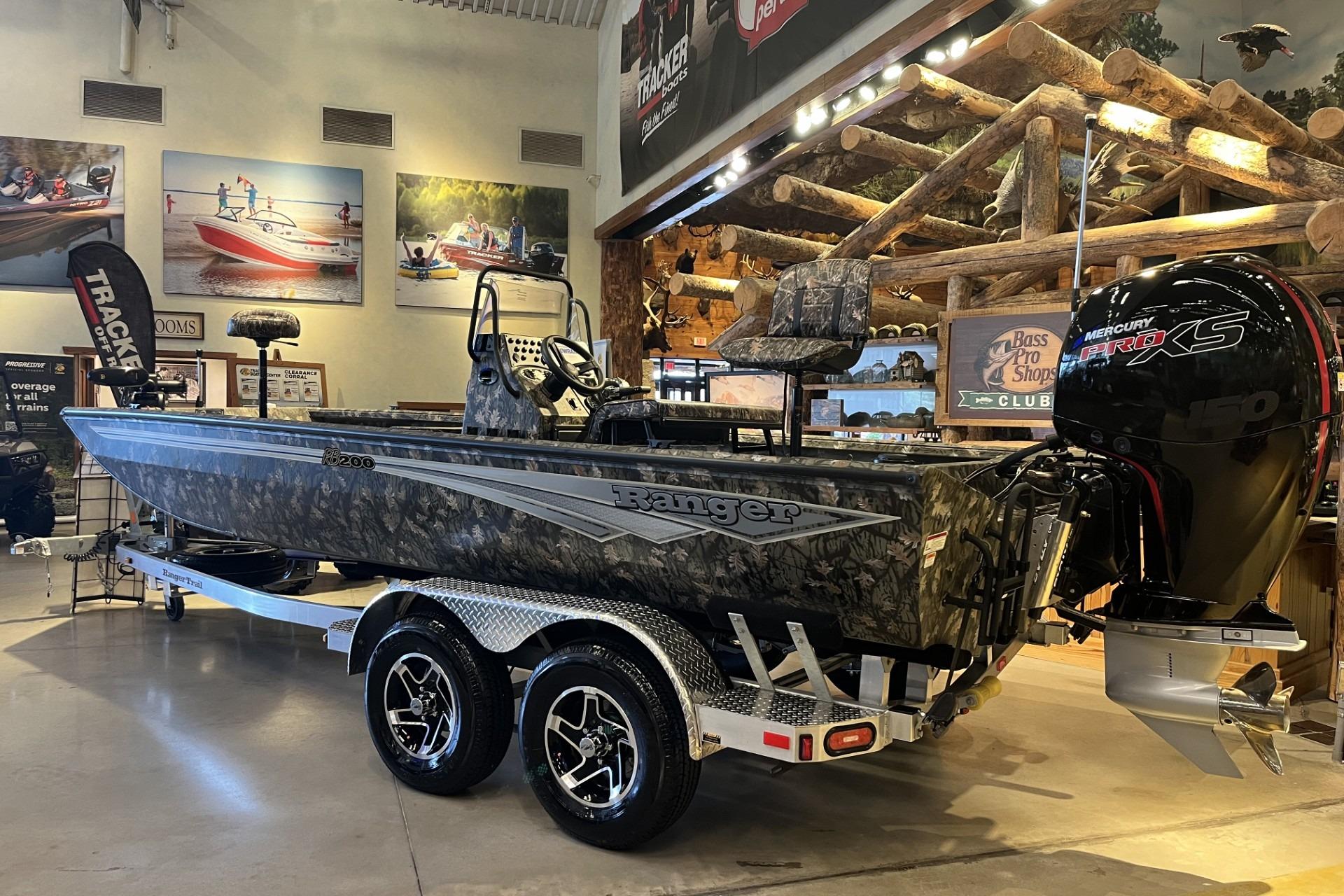 2026 Ranger RB200 boat with camo design and Mercury Pro XS engine in showroom.