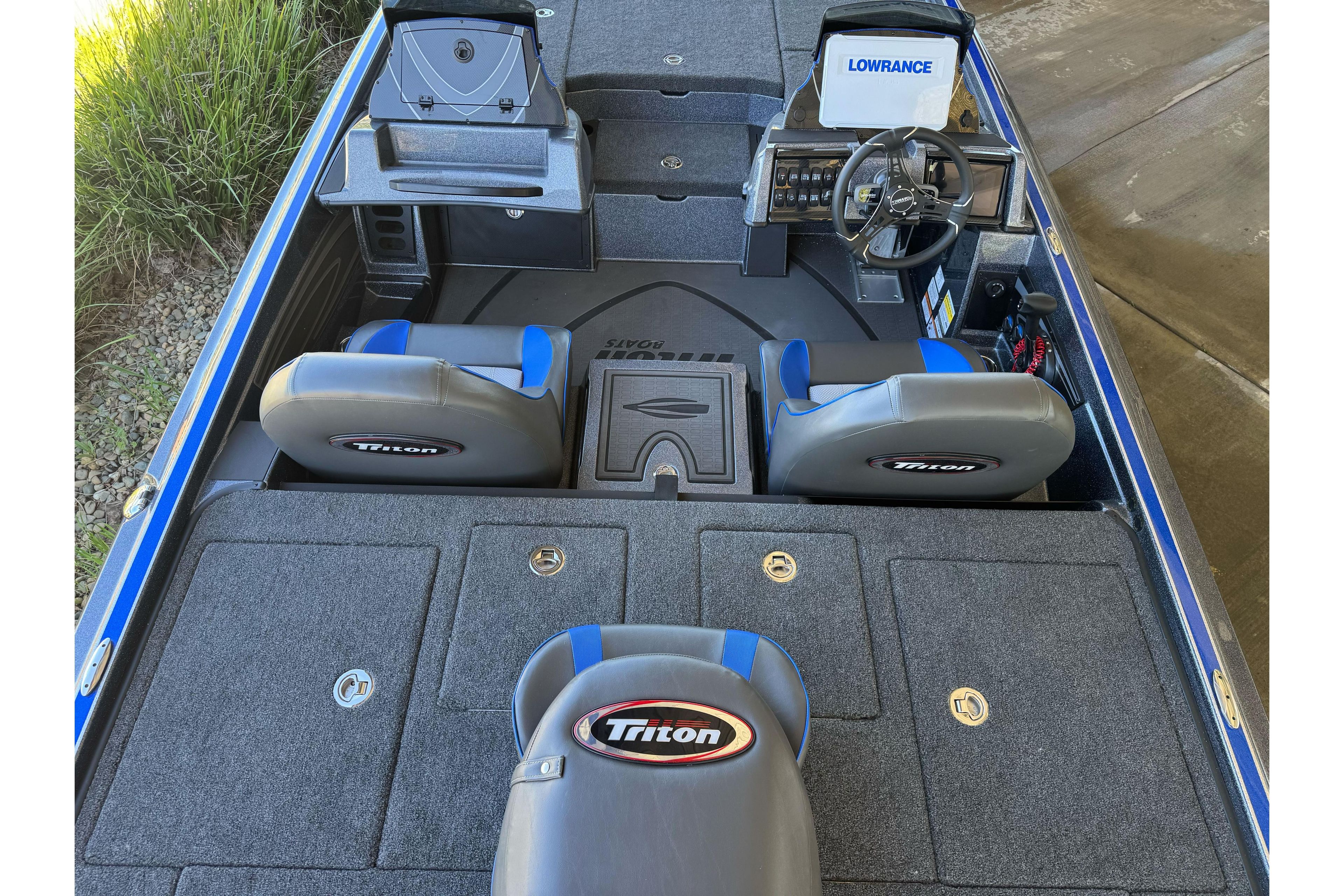 2026 Triton 21XP Patriot boat interior with Lowrance electronics and Triton-branded seats.