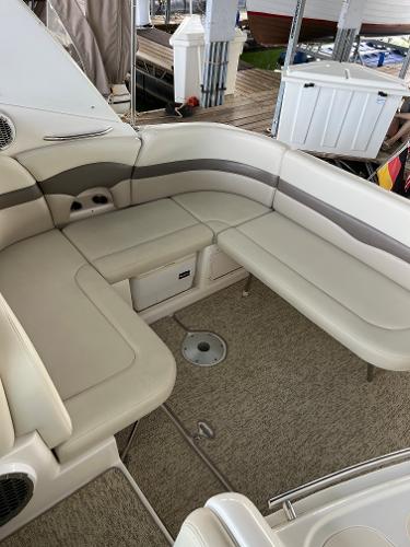 Interior of a 2008 Chaparral Signature 310 yacht with beige seating.