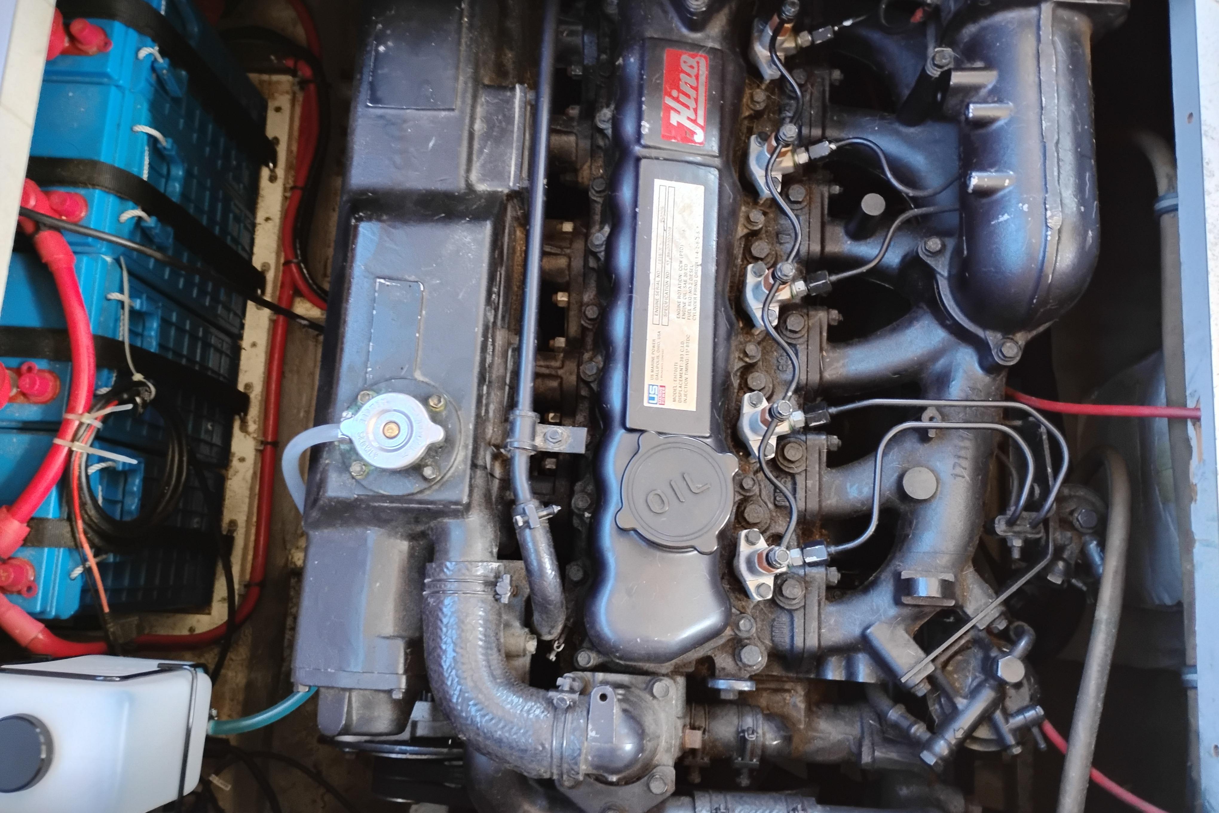 Engine compartment of a 1989 Bayliner 4588 Pilothouse, showcasing detailed mechanical components.