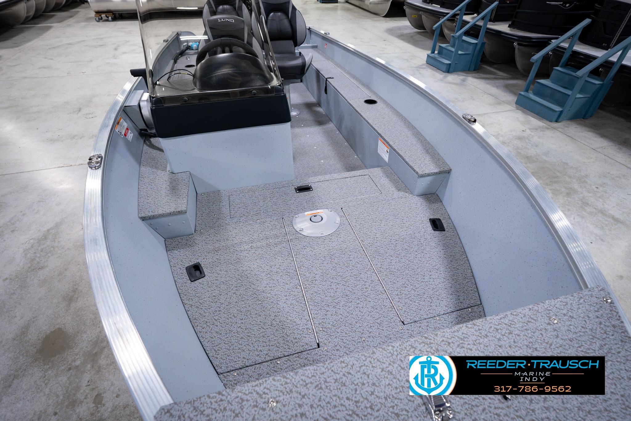 2026 Lund 1600 Fury SS fishing boat interior with seating and storage compartments.