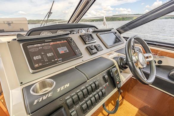 2016 Sea Ray Sundancer 510 helm with advanced navigation controls and scenic water view.