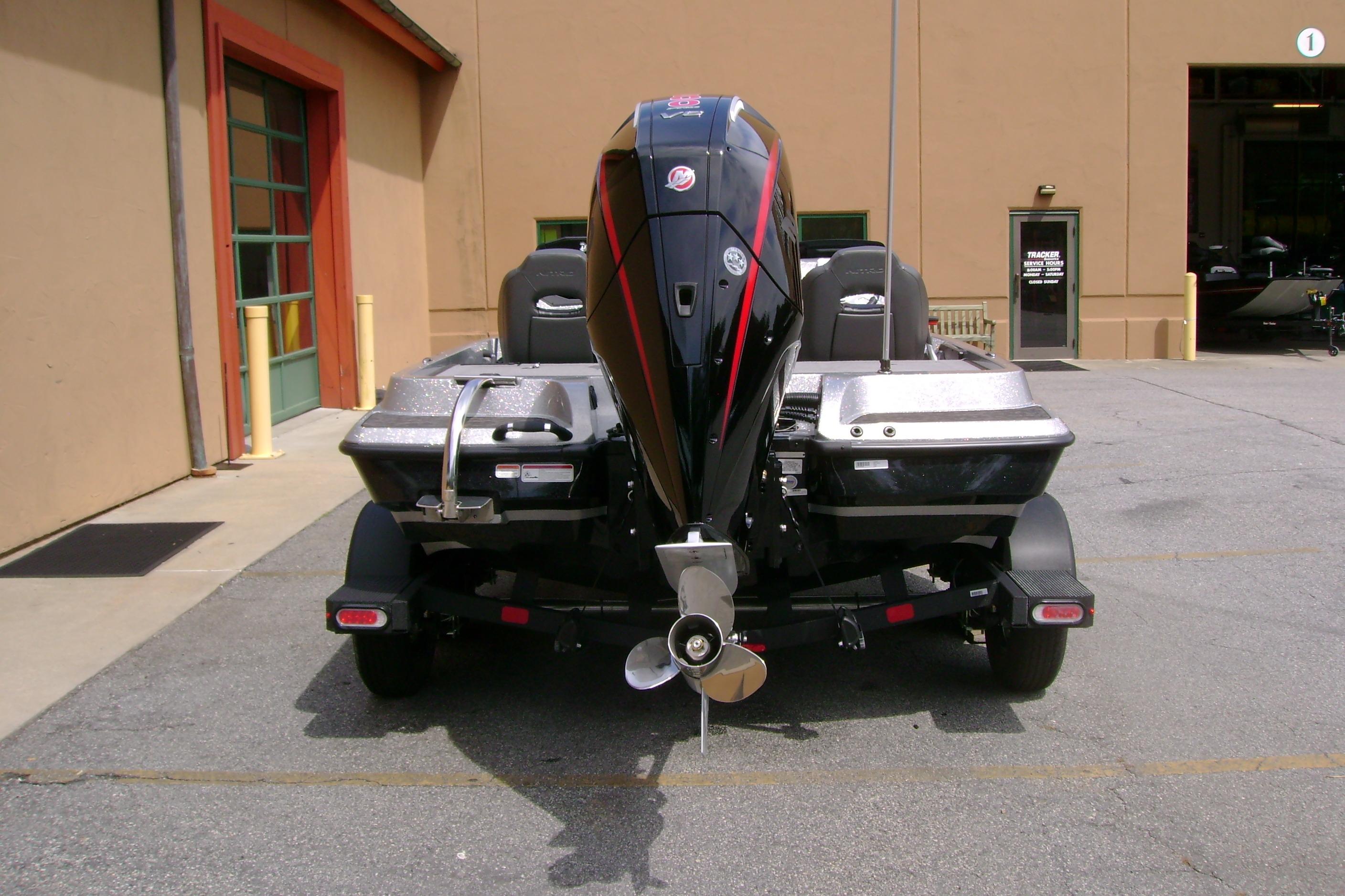2026 Nitro Z19 XL boat rear view, parked outside a building.