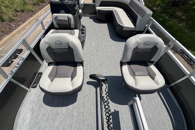 2026 Sun Tracker Bass Buggy 16 XL Select pontoon boat interior with seating and steering console.