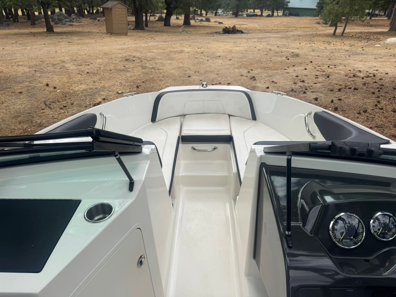 The image shows the cockpit of a 2016 Sea Ray SPX 190 Outboard boat, on dry land.