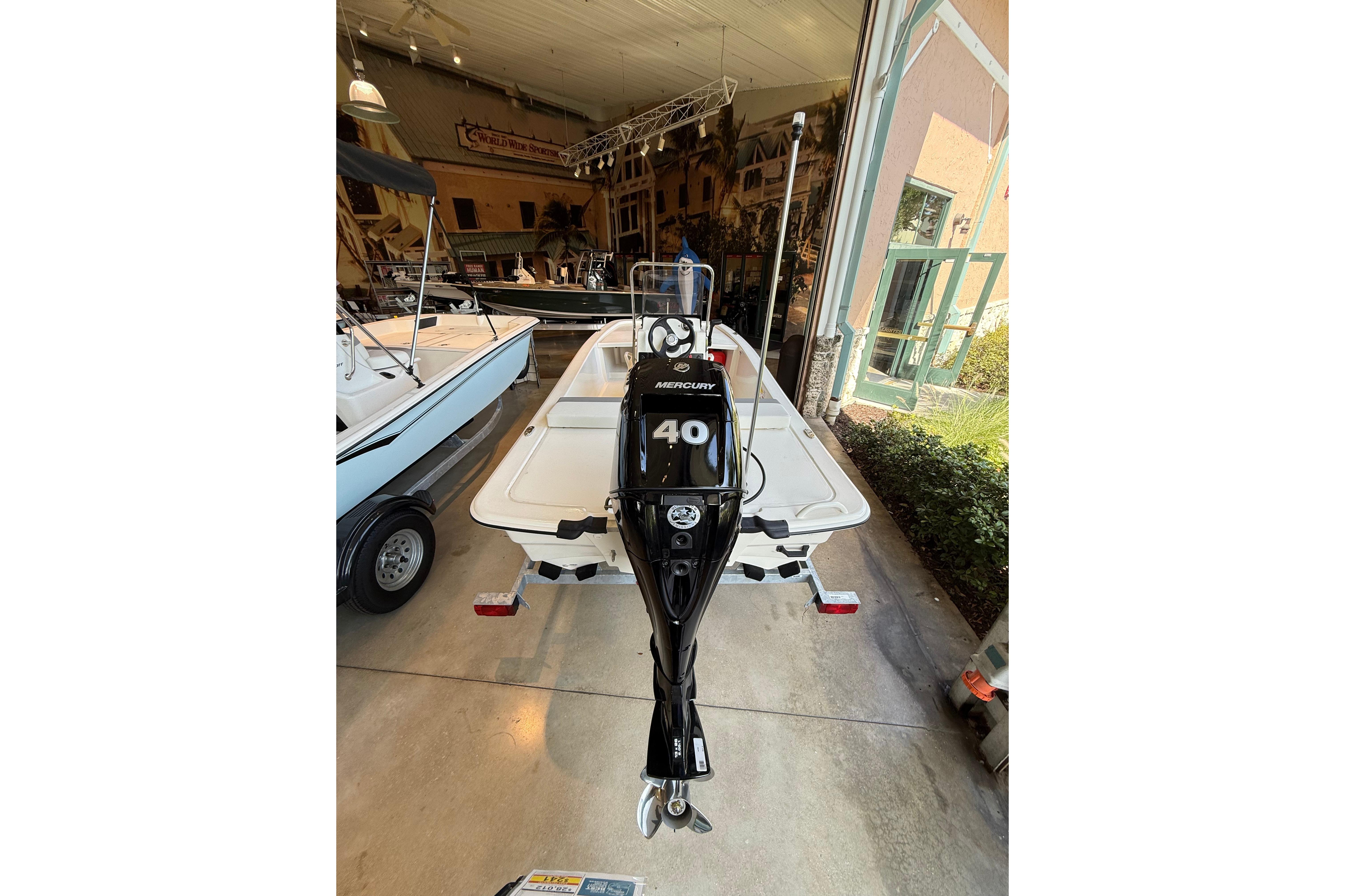 2026 Mako Pro Skiff 13 CC with Mercury 40 engine in showroom.