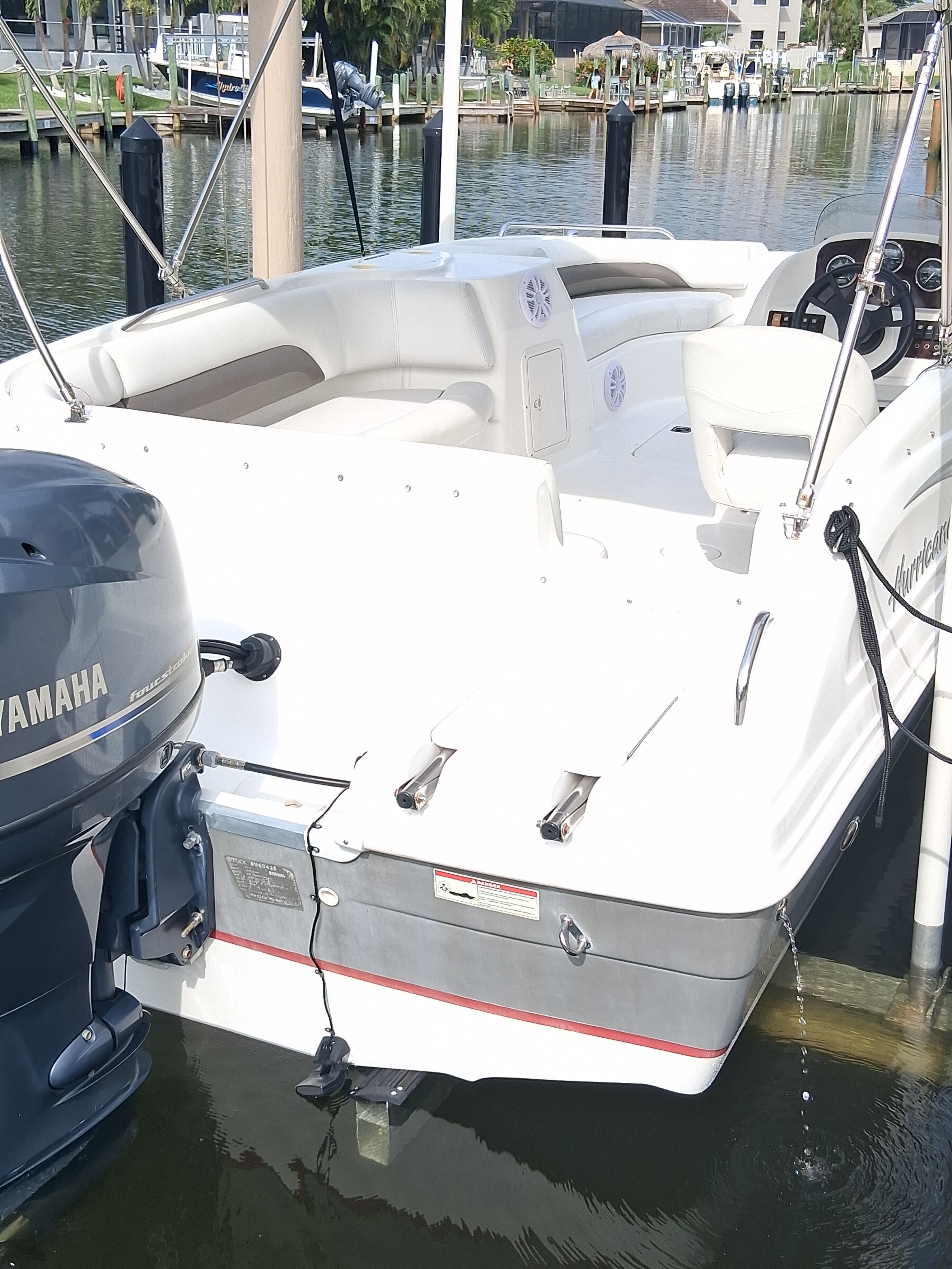 2013 Hurricane 188SD boat docked on water.
