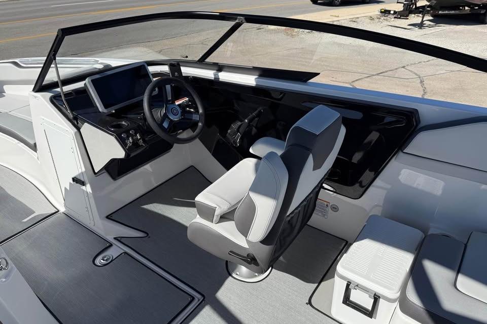 2026 Yamaha AR250 boat interior with modern helm and seating.