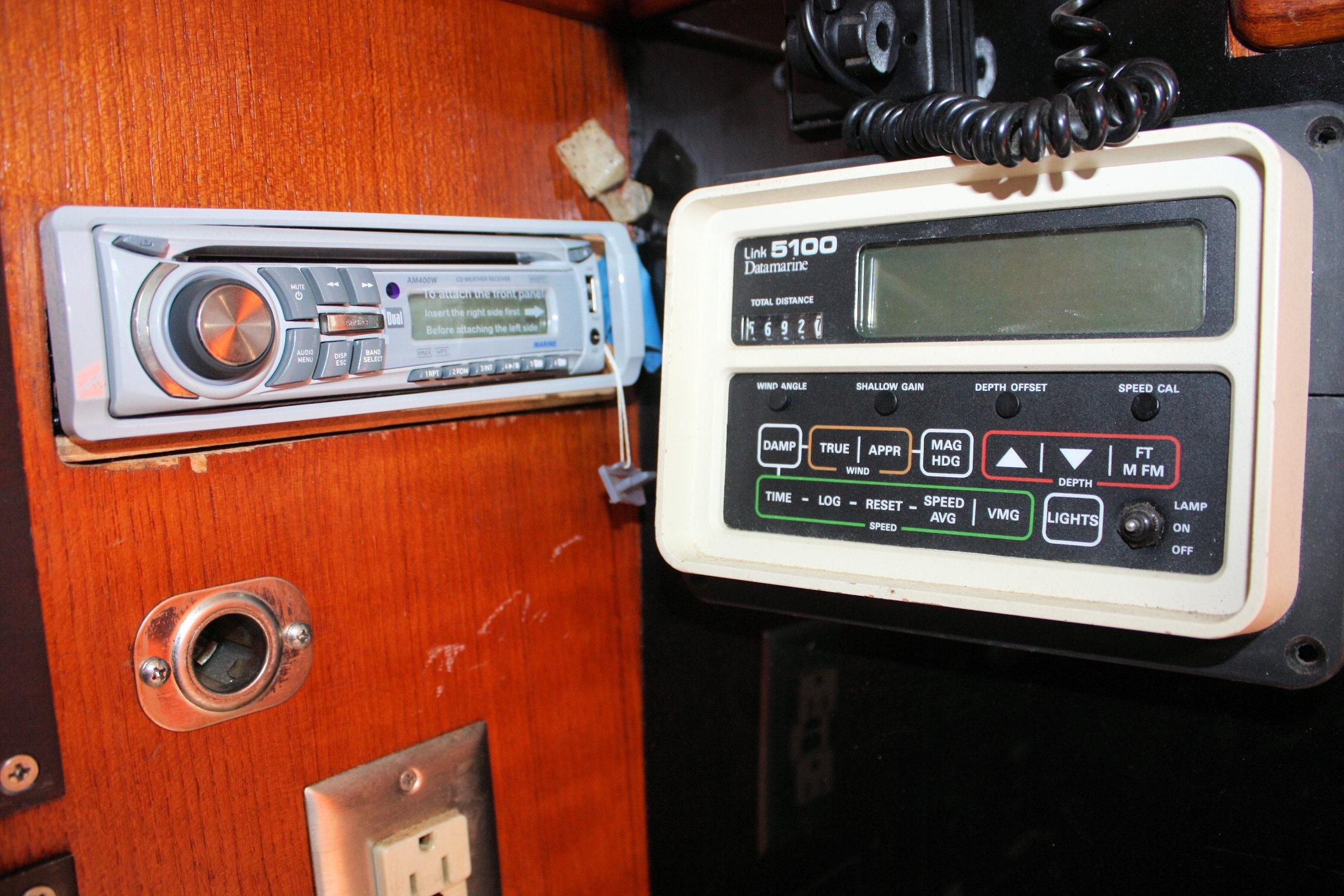 Control panel and stereo system on a 1987 Ericson 38-200 sailboat.