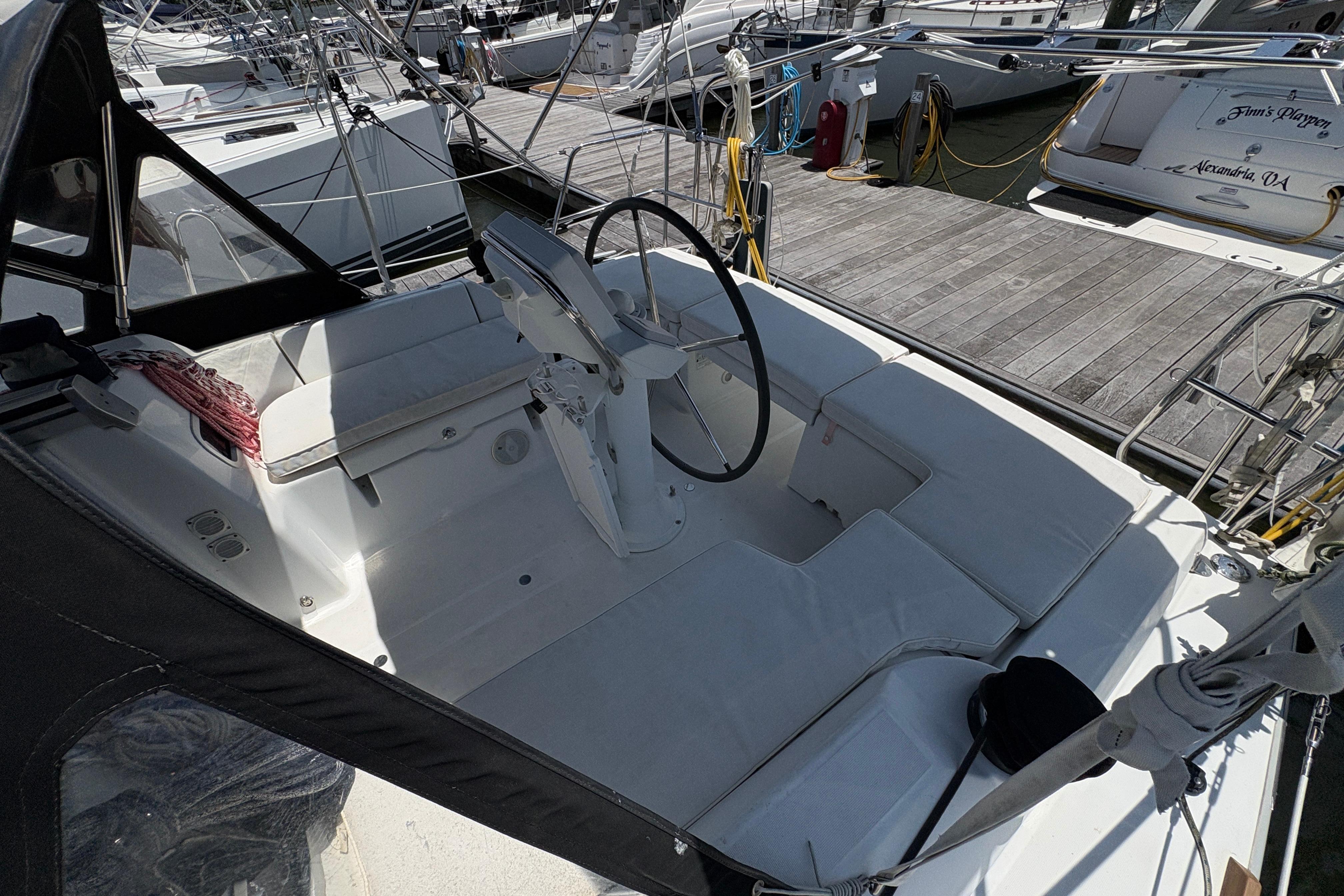 Cockpit of a 2015 Beneteau Oceanis 34 sailboat docked at a marina.