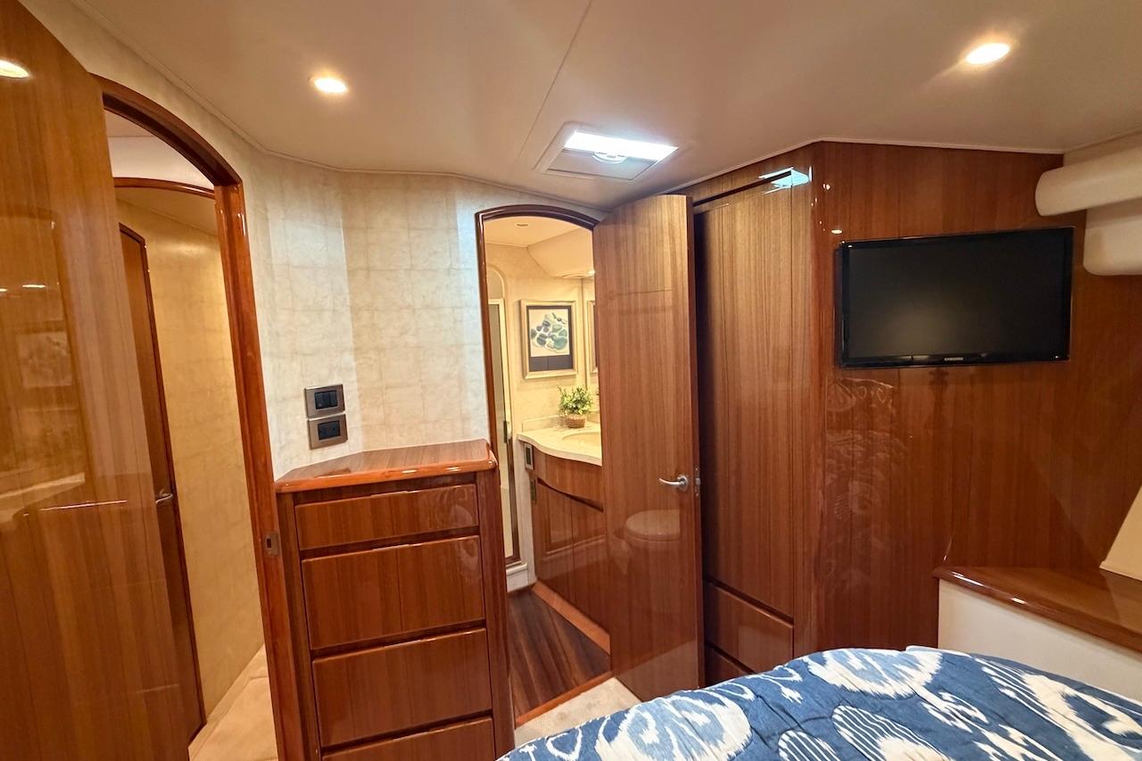 Luxurious interior of 2012 Viking 50 Convertible yacht with wood finishes and modern amenities.