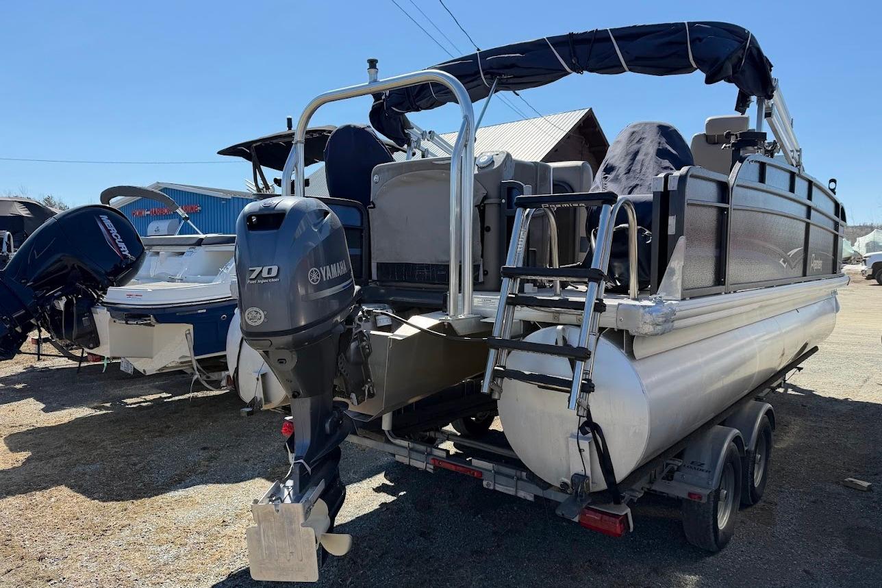 2013 Premier 221 Explorer pontoon boat with Yamaha 70 outboard motor on trailer.
