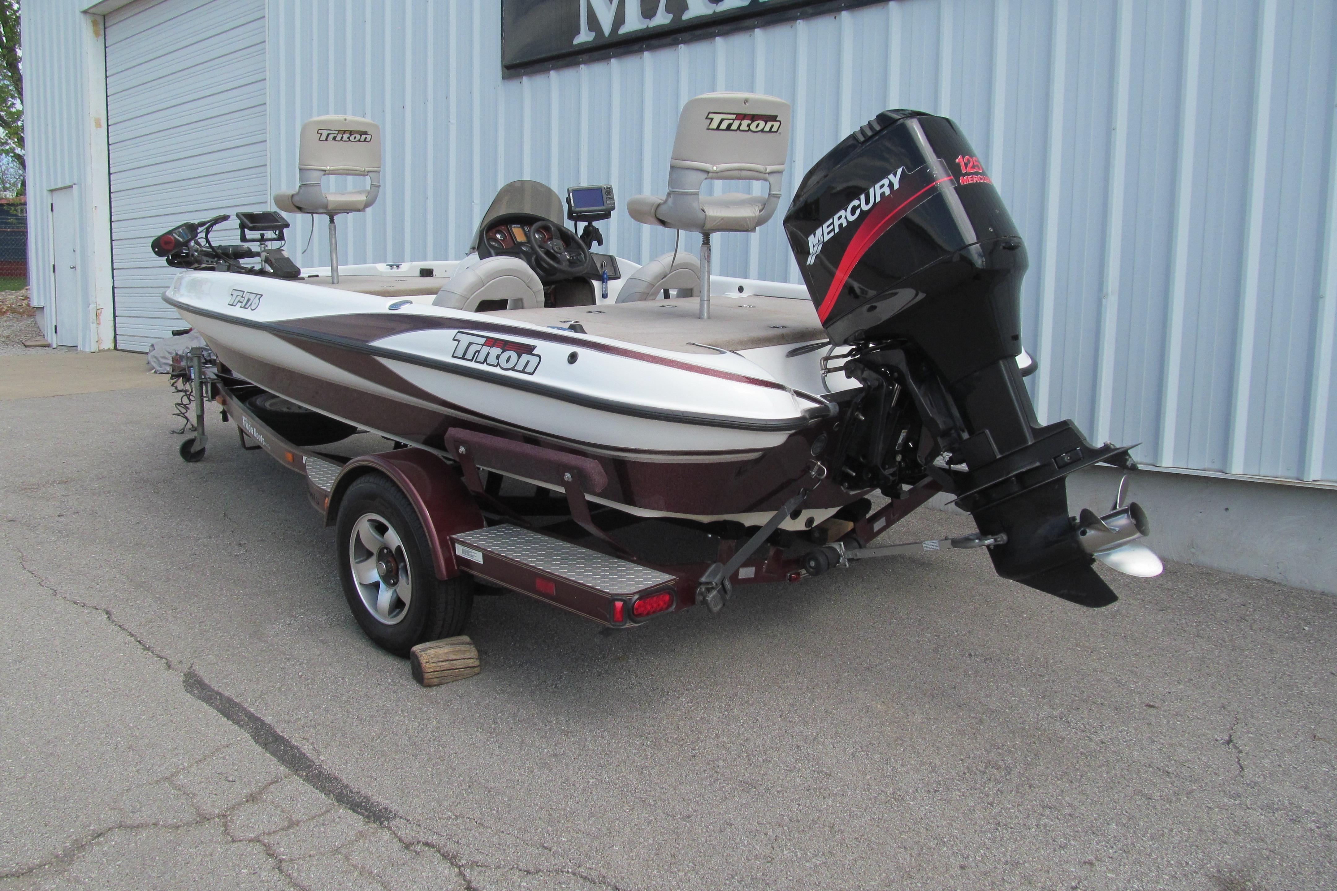 2002 Triton Tr-176 SC boat with Mercury engine on trailer.