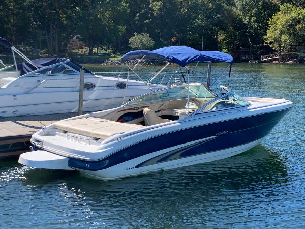 2000 Sea Ray 210 Bow Rider boat docked on a sunny day.
