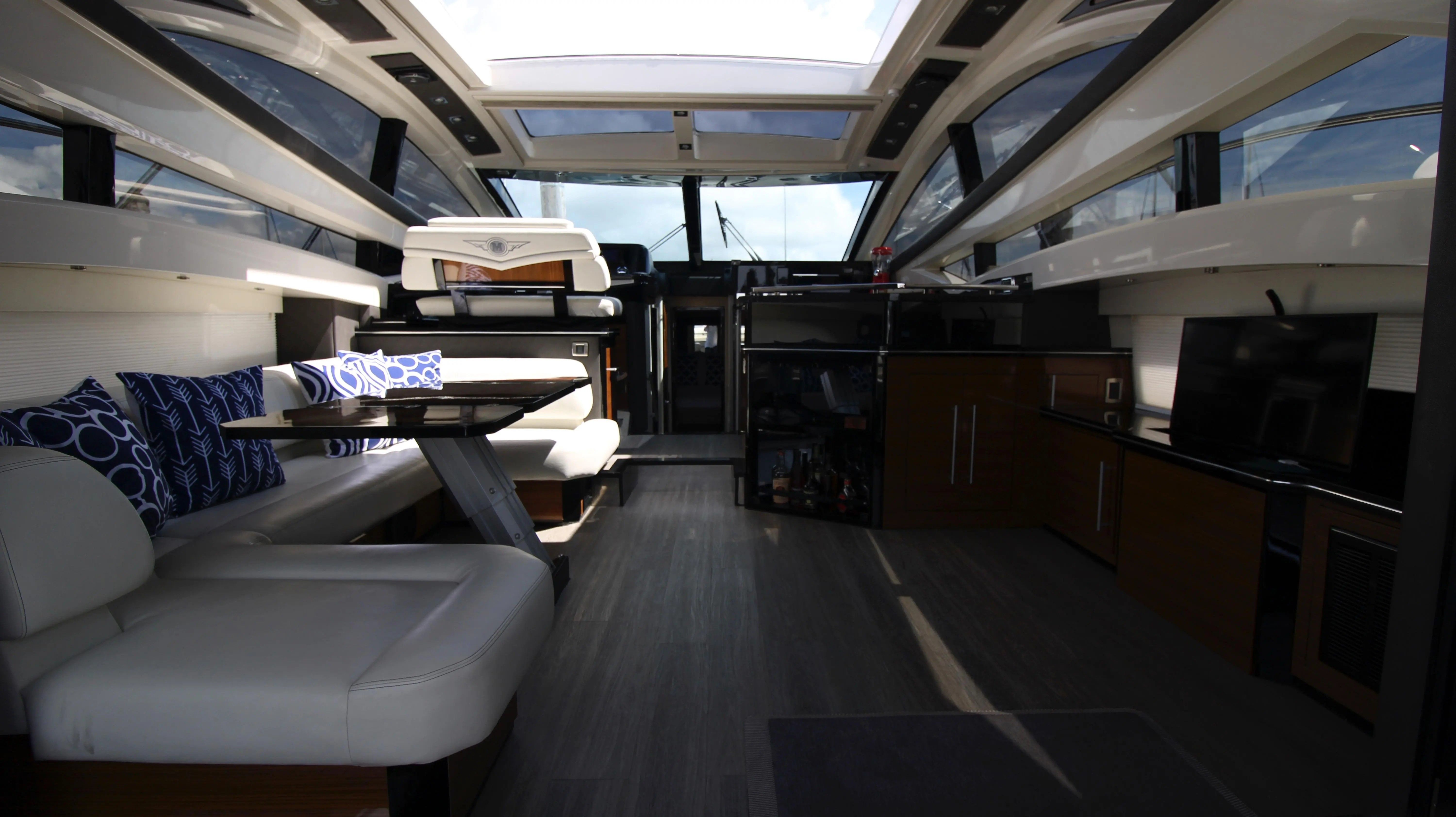 Interior of a 2010 Marquis Sport Coupe with sleek seating area and modern amenities.