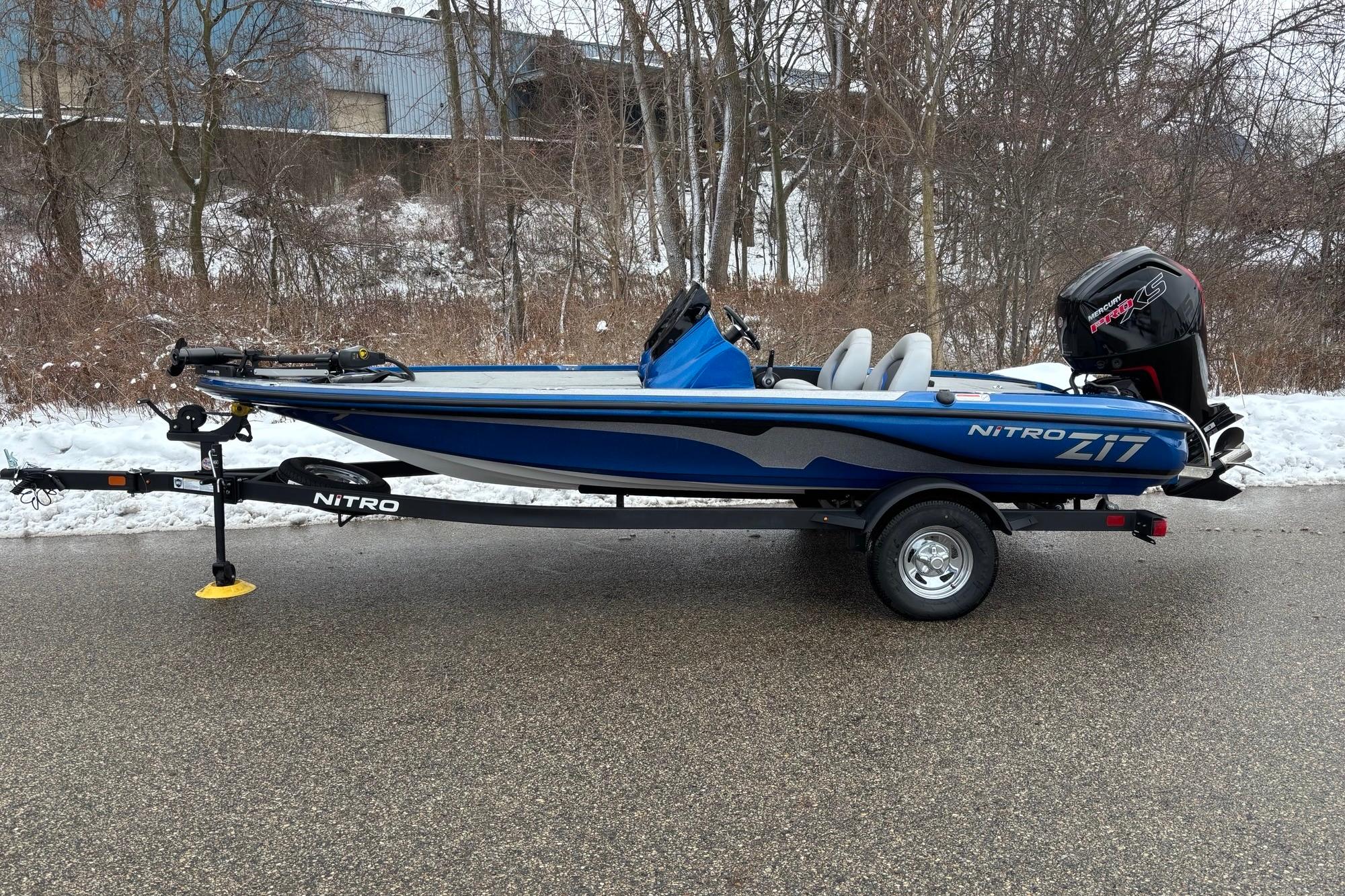 2026 Nitro Z17 boat on trailer, parked on snowy road.