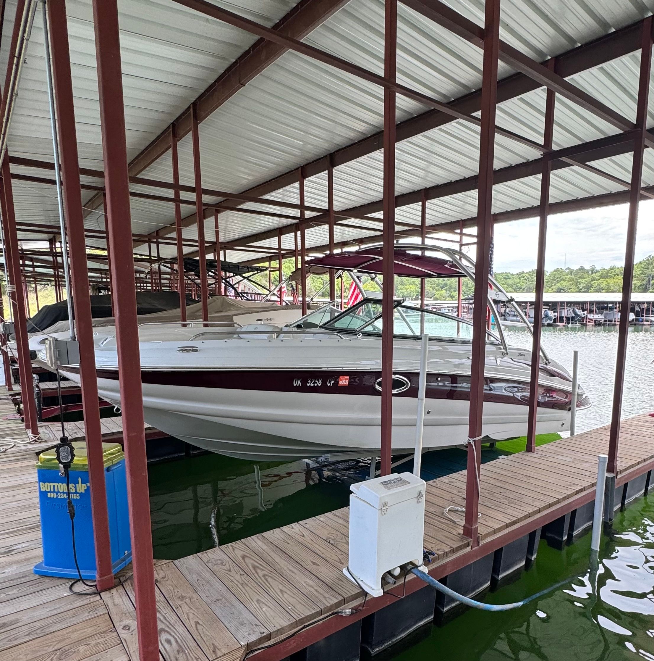 2008 Crownline 252EX in a covered boat slip.