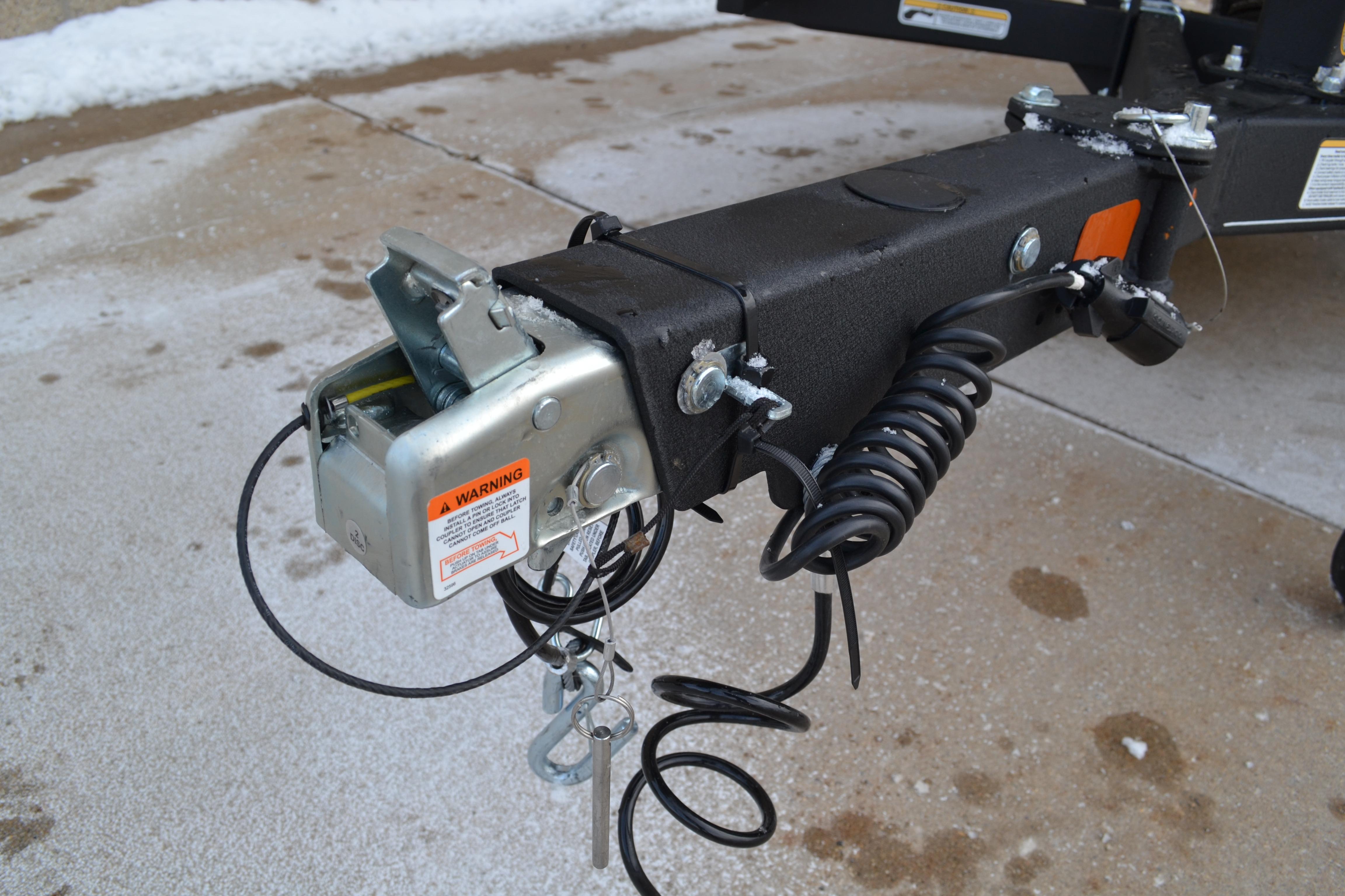 Trailer hitch of 2026 Ranger VX1888 WT on snowy pavement.