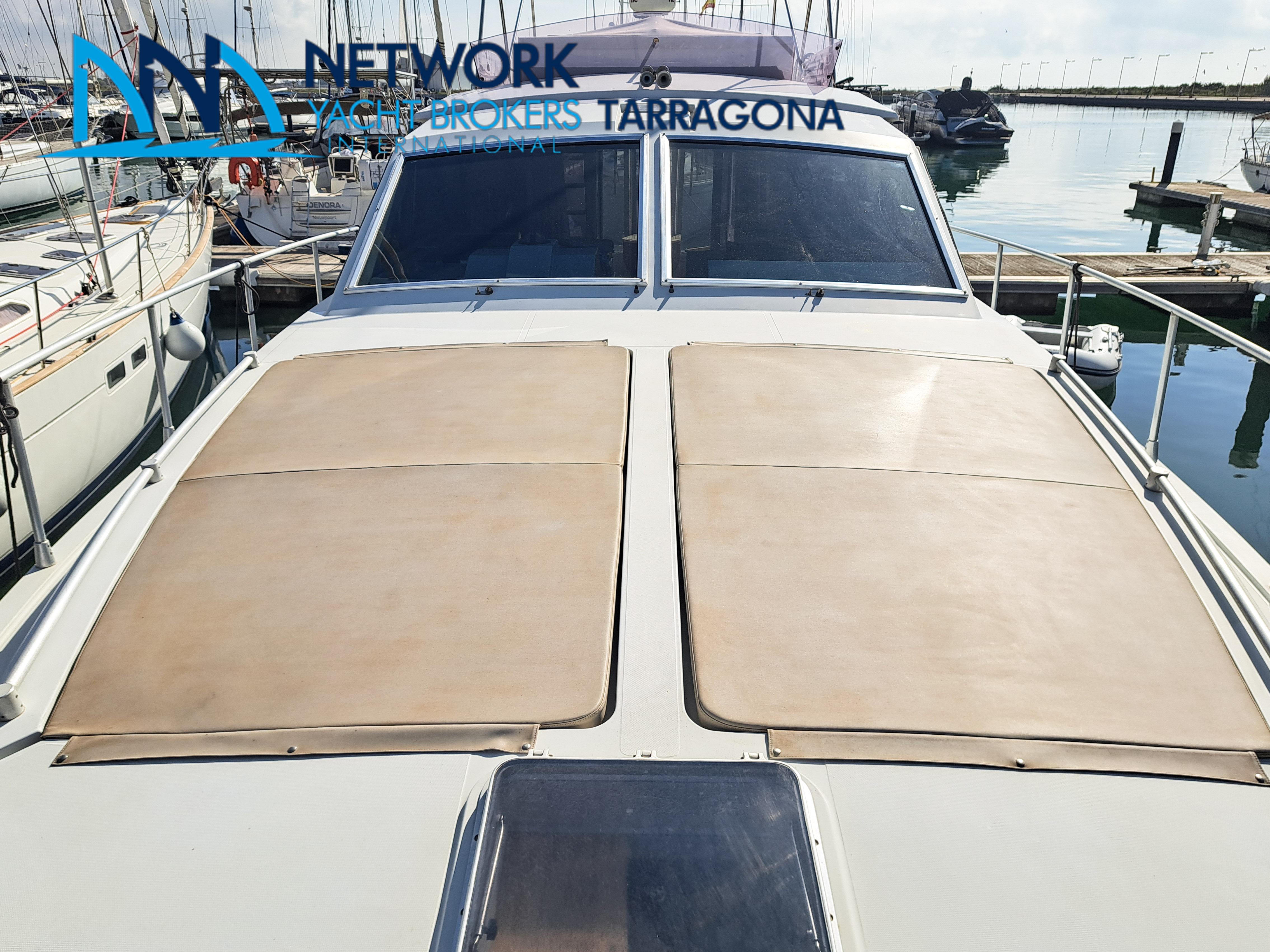 1989 Raffaelli Storm yacht docked in Tarragona harbor.