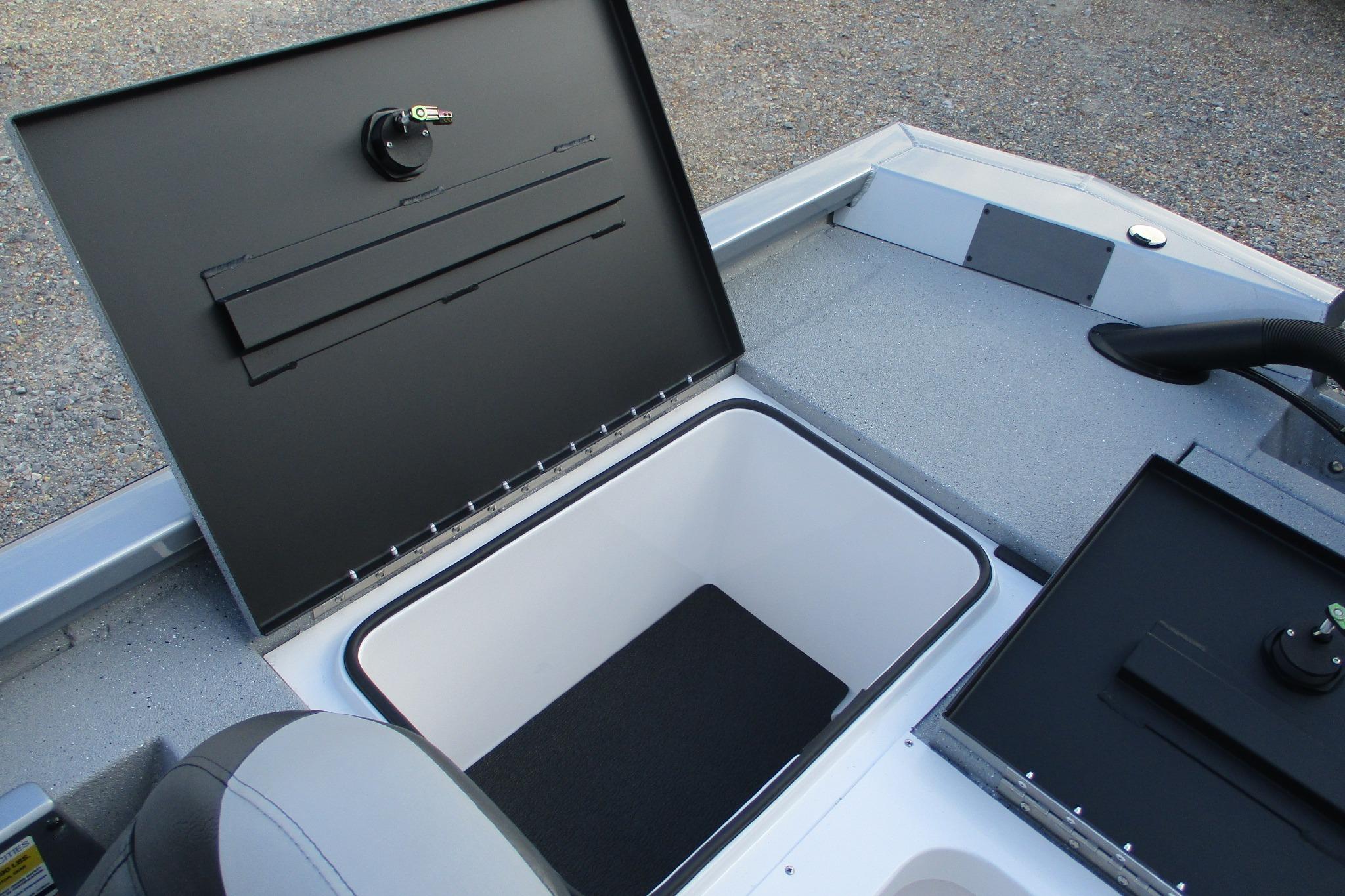 2026 Vexus AVX2080 boat storage compartment with open lid, showcasing interior space.