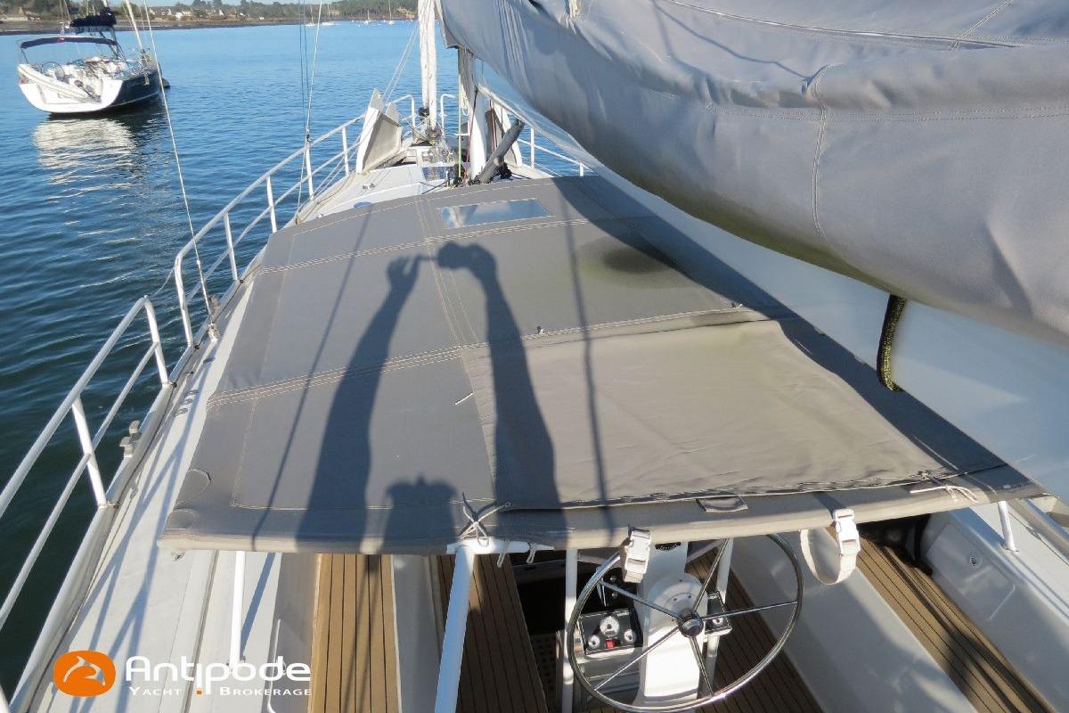 Sailboat deck with steering wheel, shadows, and water view; Meta JPB 52, 2021 model.